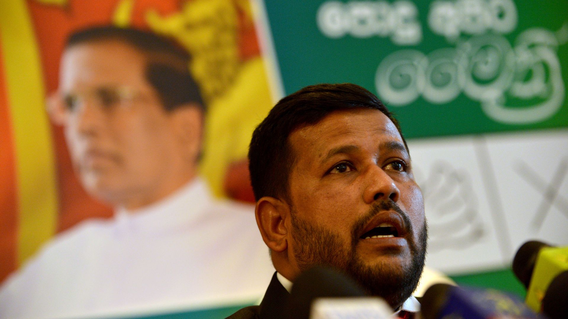 Rishad Bathiudeen speaking in 2014.