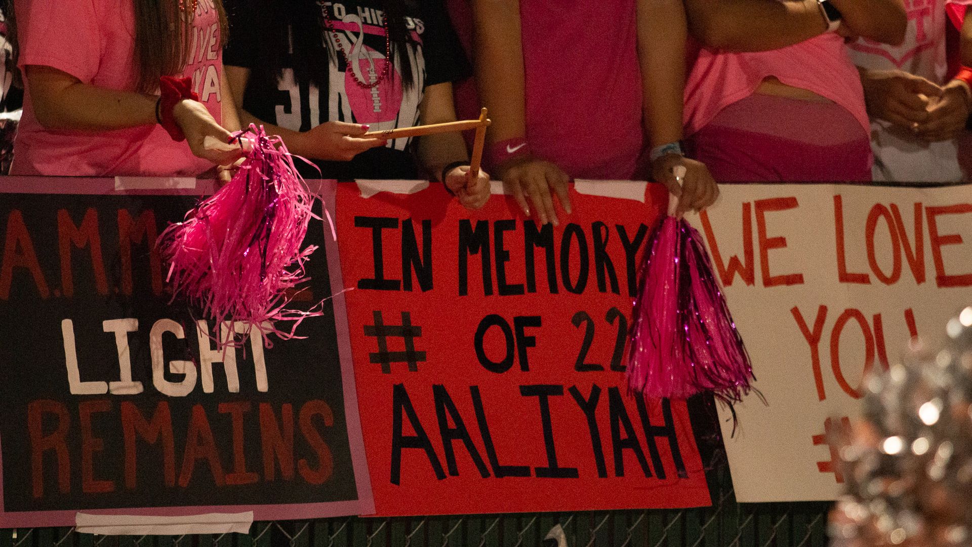 Poster in memory of Aaliyah Marie Martinez at a Hutto football game.