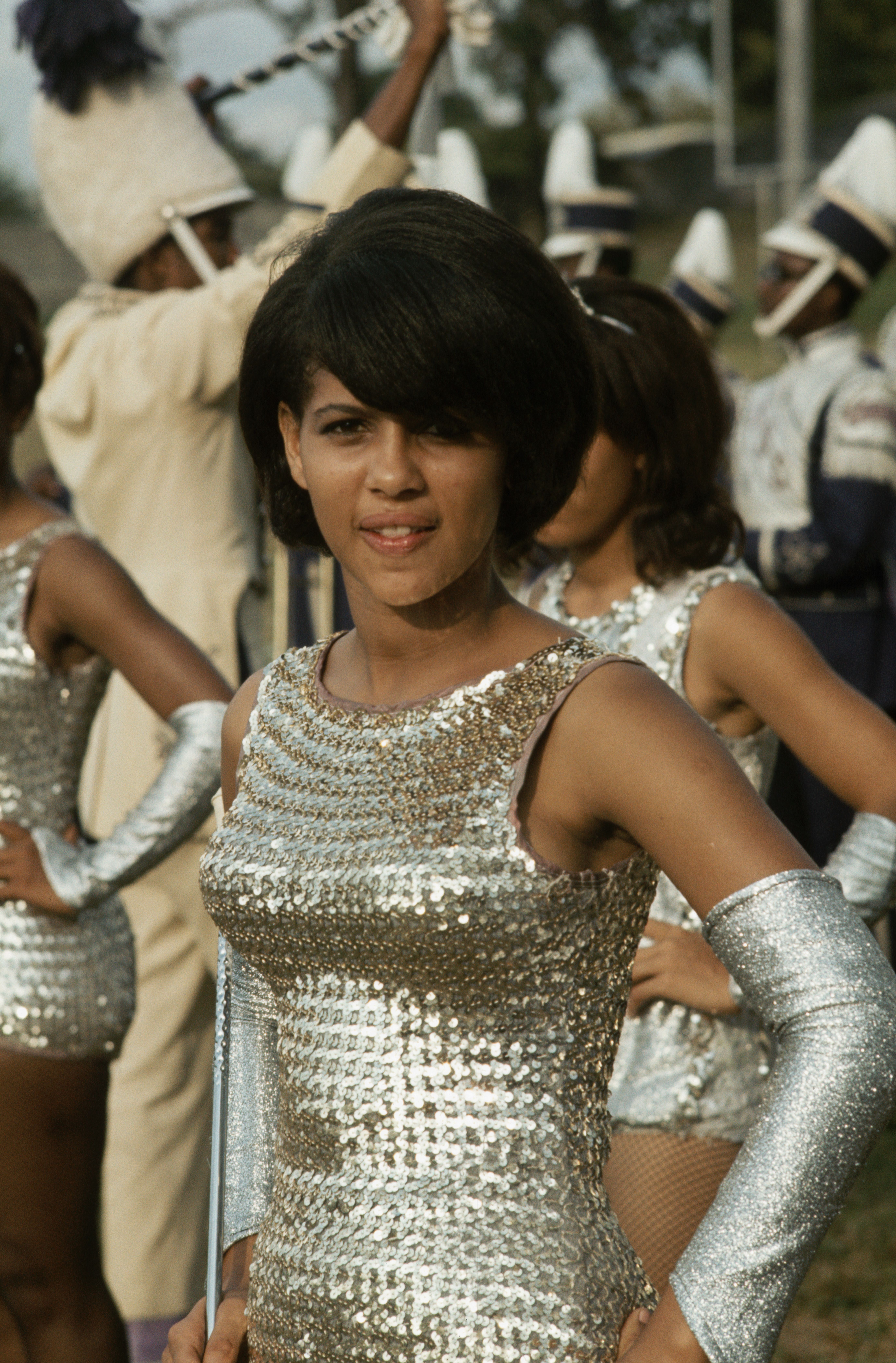 A baton twirler waits to perform at a Morris Brown College football game. Atlanta, Georgia. (Photo by James L. Amos/Corbis via Getty Images)