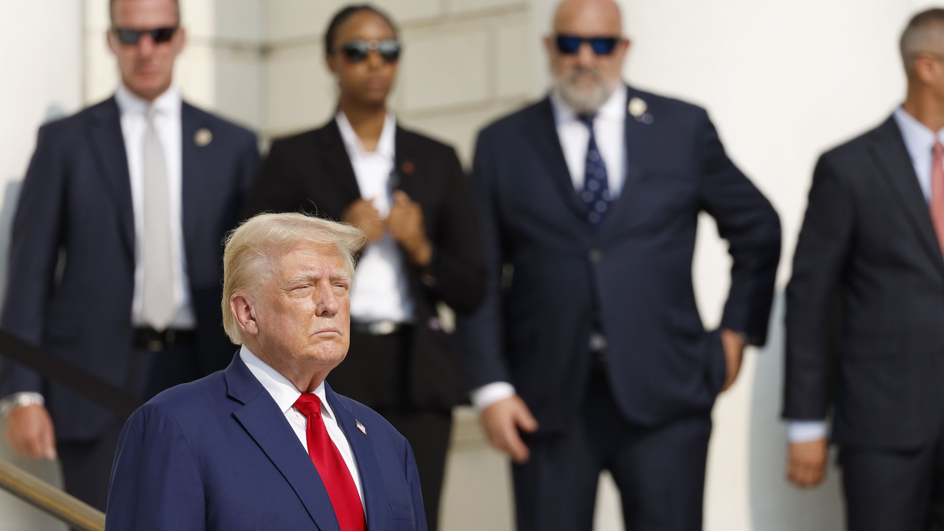 Trump looks on during a wreath-laying ceremony at Arlington National Cemetery.