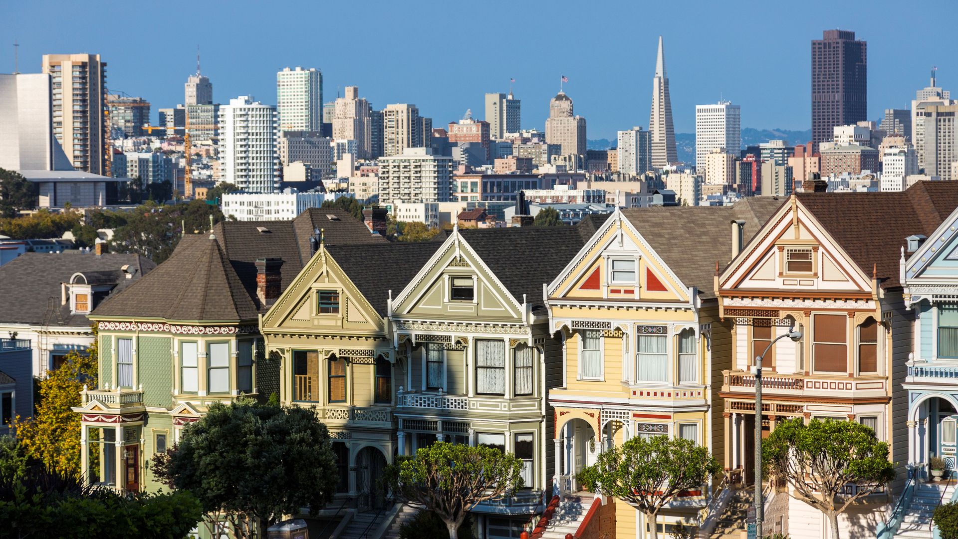 A row of painted Victorian houses