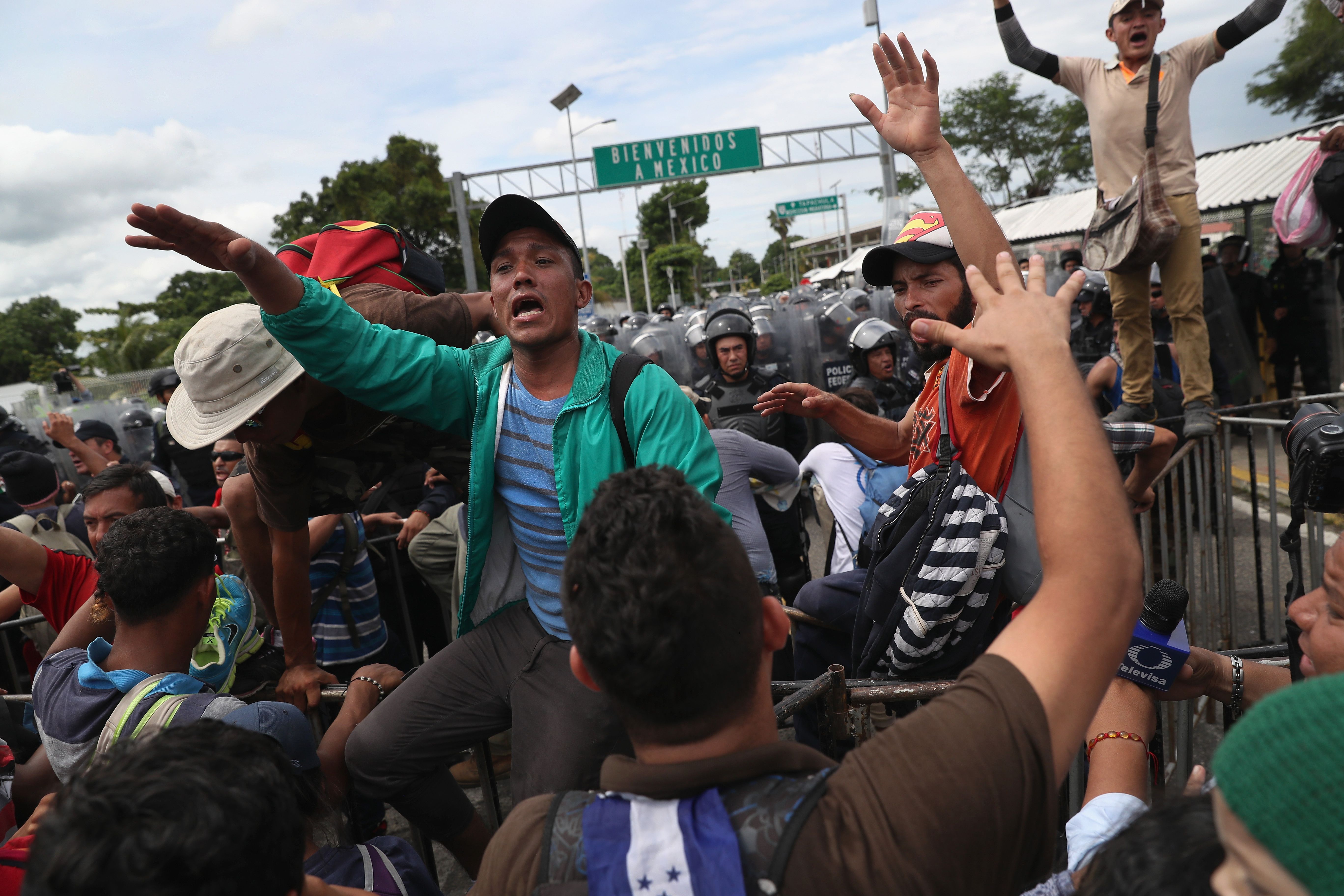 Migrants trying to turn people around before clashing with police