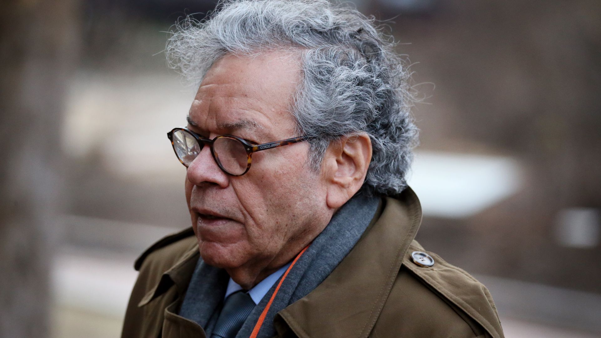 John Kapoor in a coat.