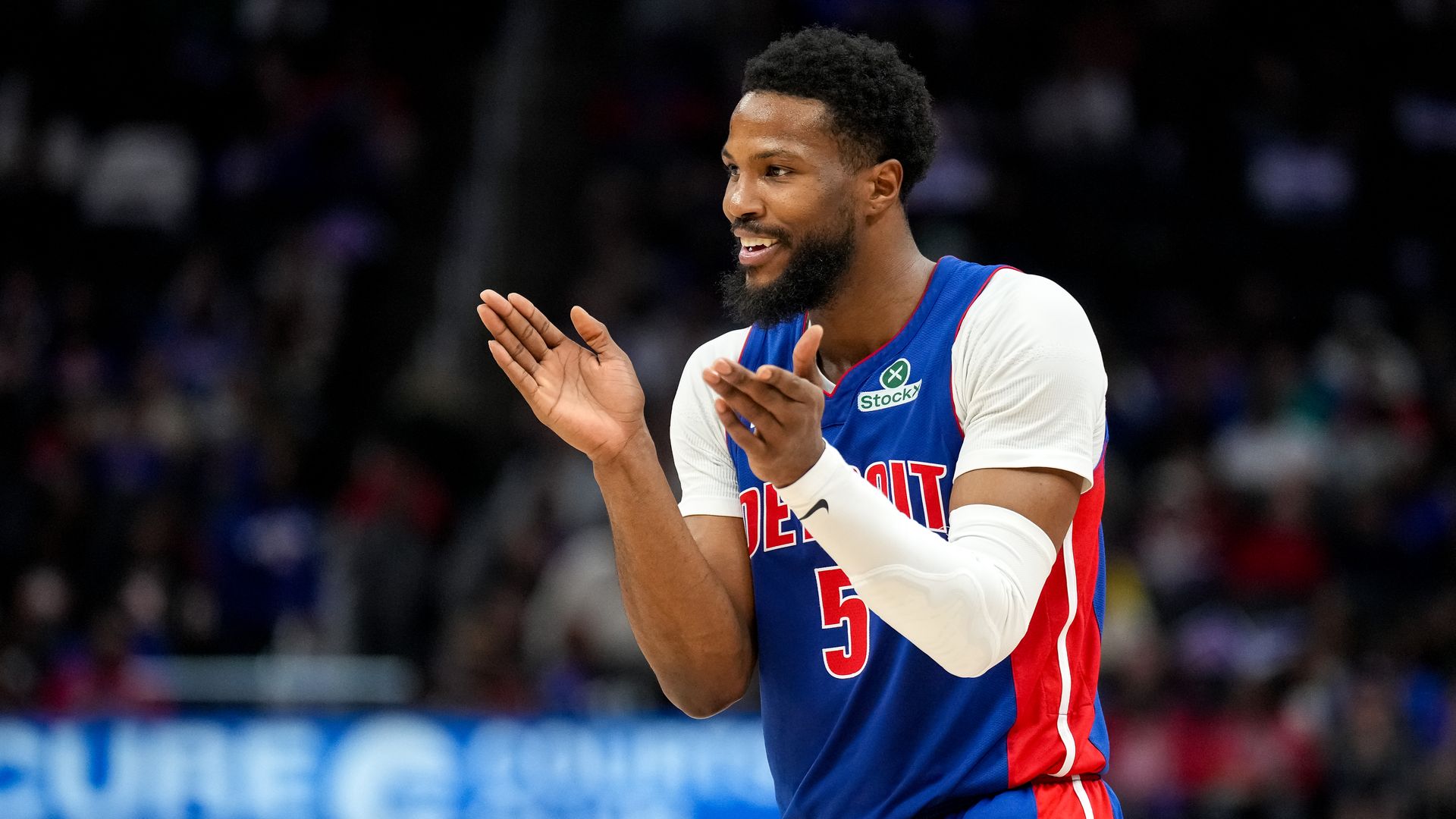 Malik Beasley claps against the Cavaliers at Little Caesars Arena in March. 