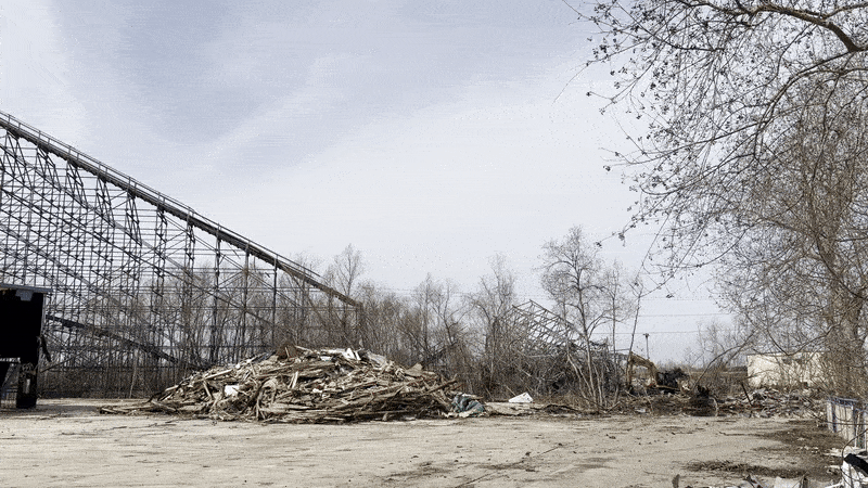 Photo shows a rollercoaster that's being demolished.