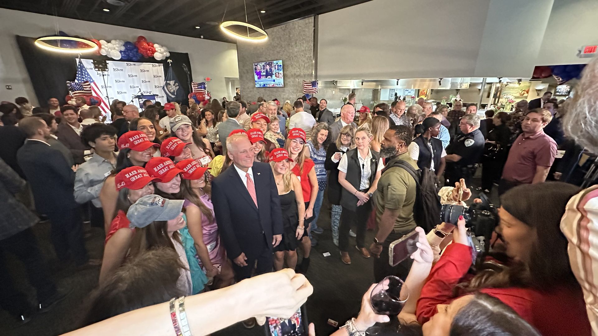 Steve Scalise for a photo poses with supporters.