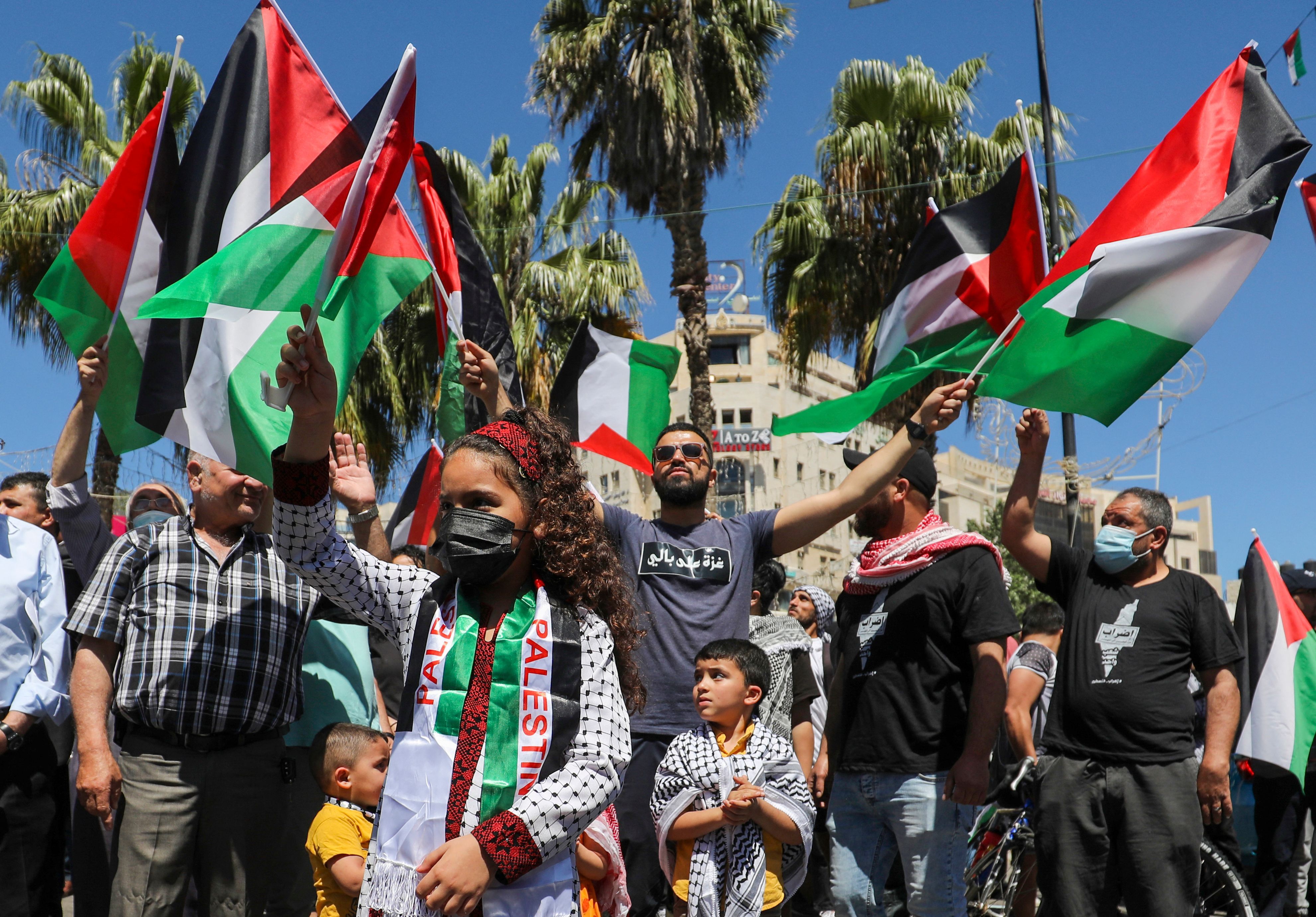 Palestinians demonstrate in the city of Ramallah, in the occupied West Bank, in solidarity with Gaza