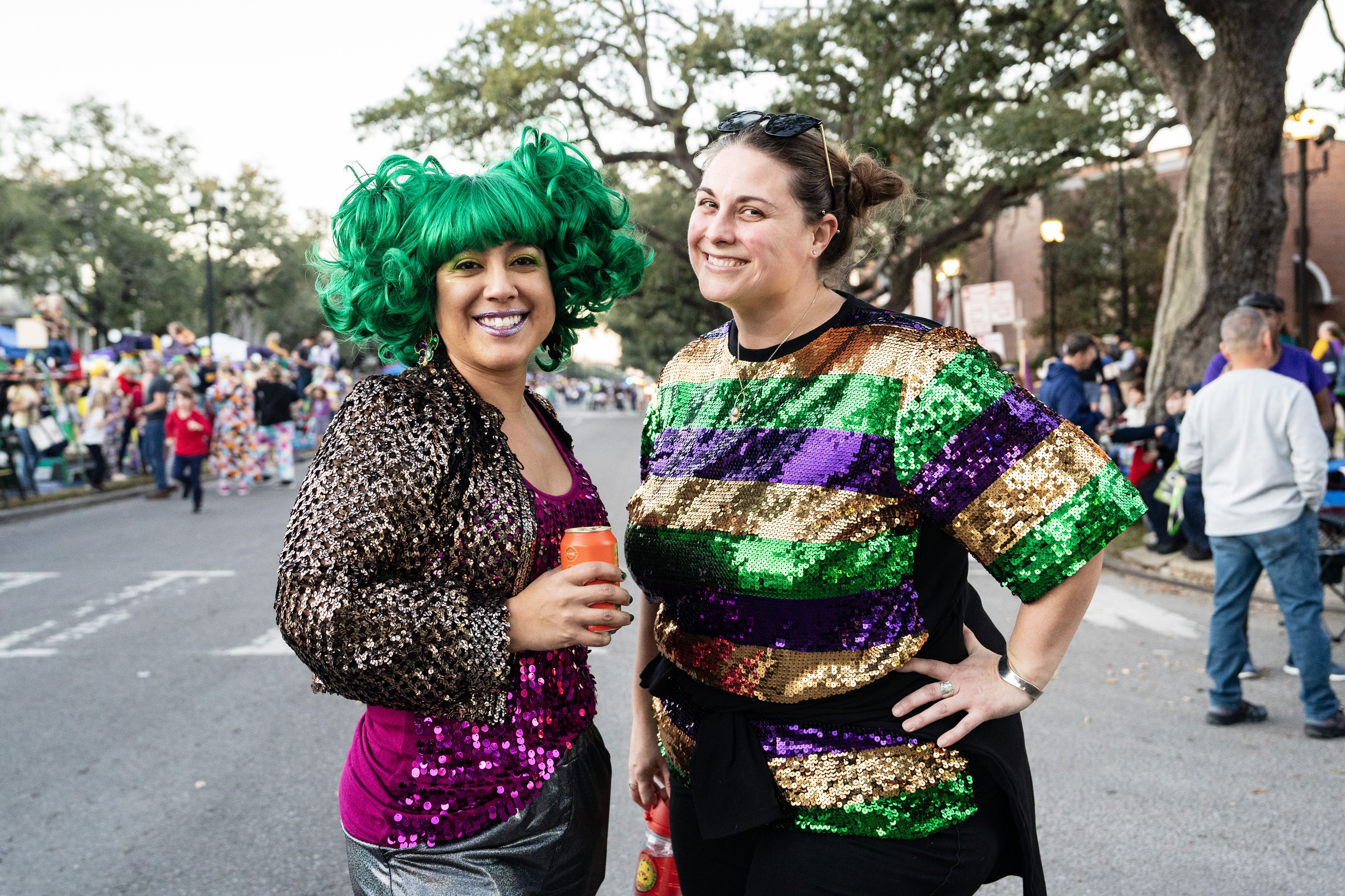 Two revelers pose for the camera on the parade route.