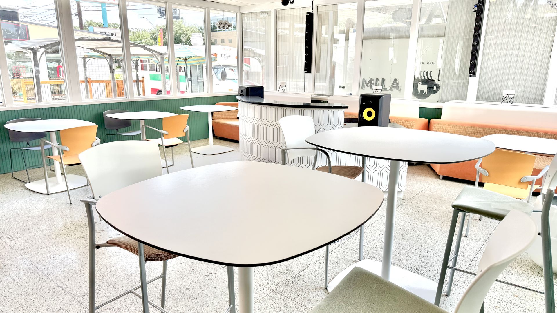 An indoor space filled with natural light and retro furnishings.