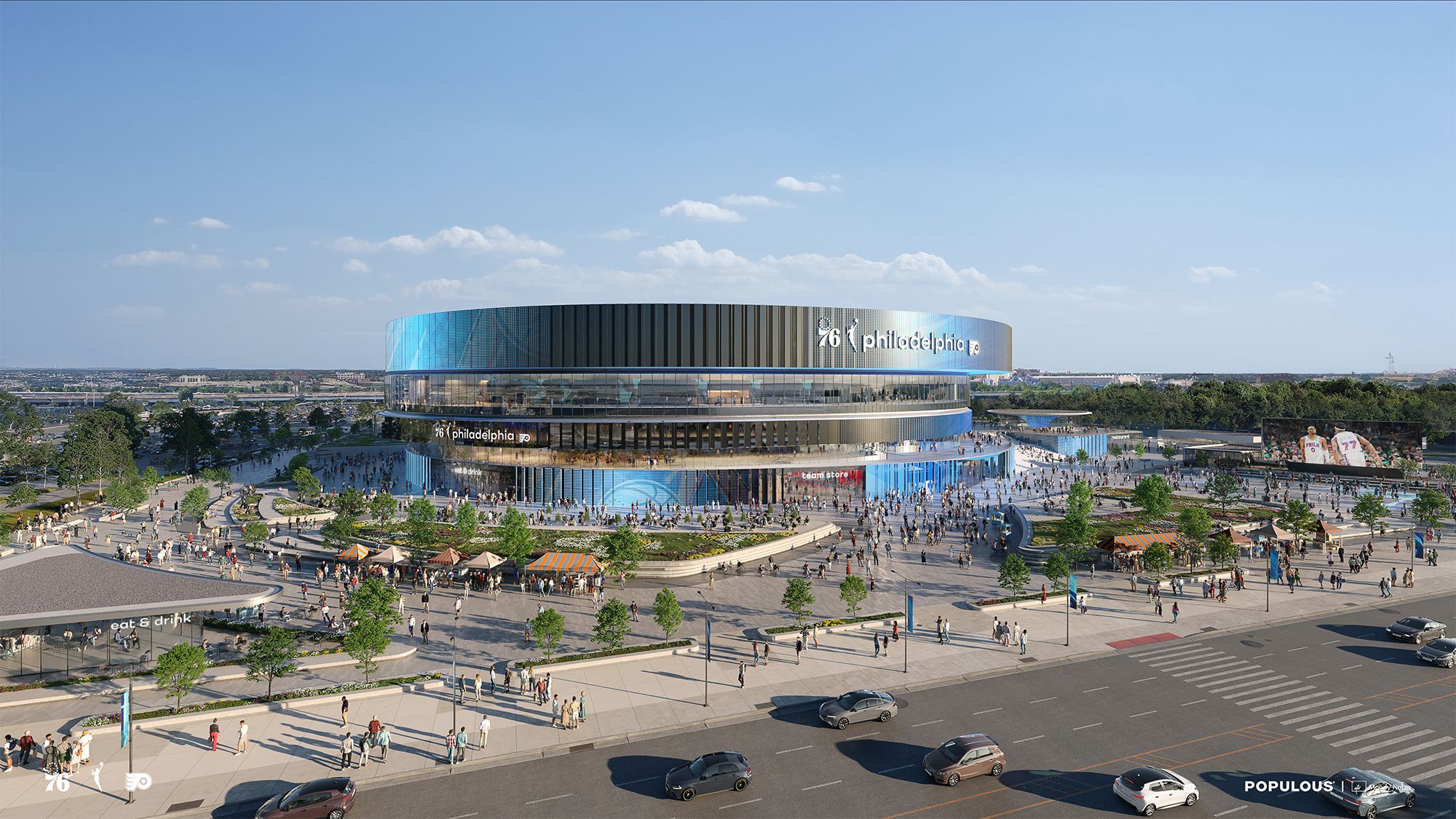 A futuristic circular stadium with blue glass panels and "Philadelphia" signage, surrounded by a busy plaza filled with people, trees, and a large outdoor screen.