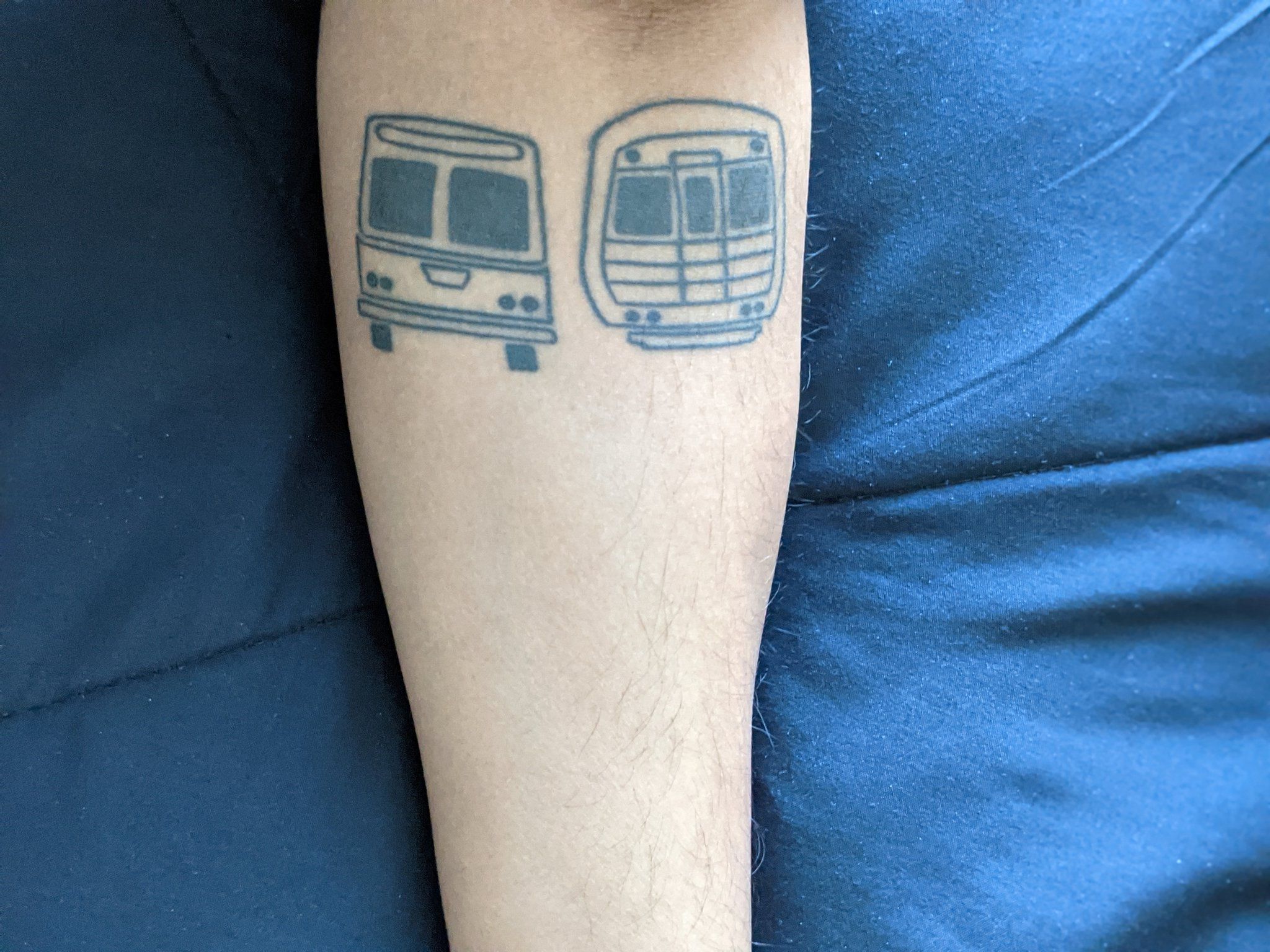 A tattoo of an early bus and train logo of MARTA, metro Atlanta's transit system
