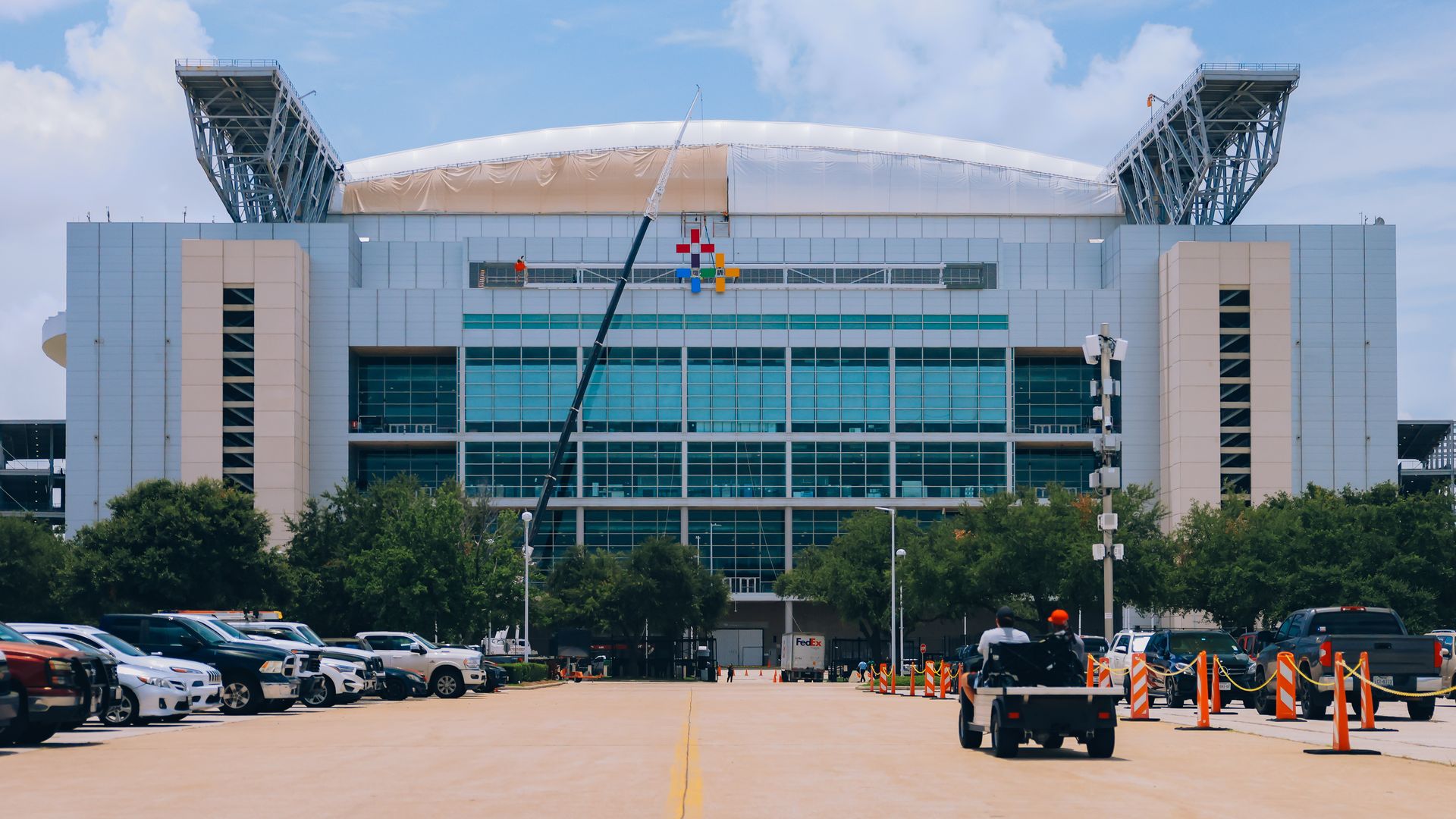A side view of NRG showing a construction crane 