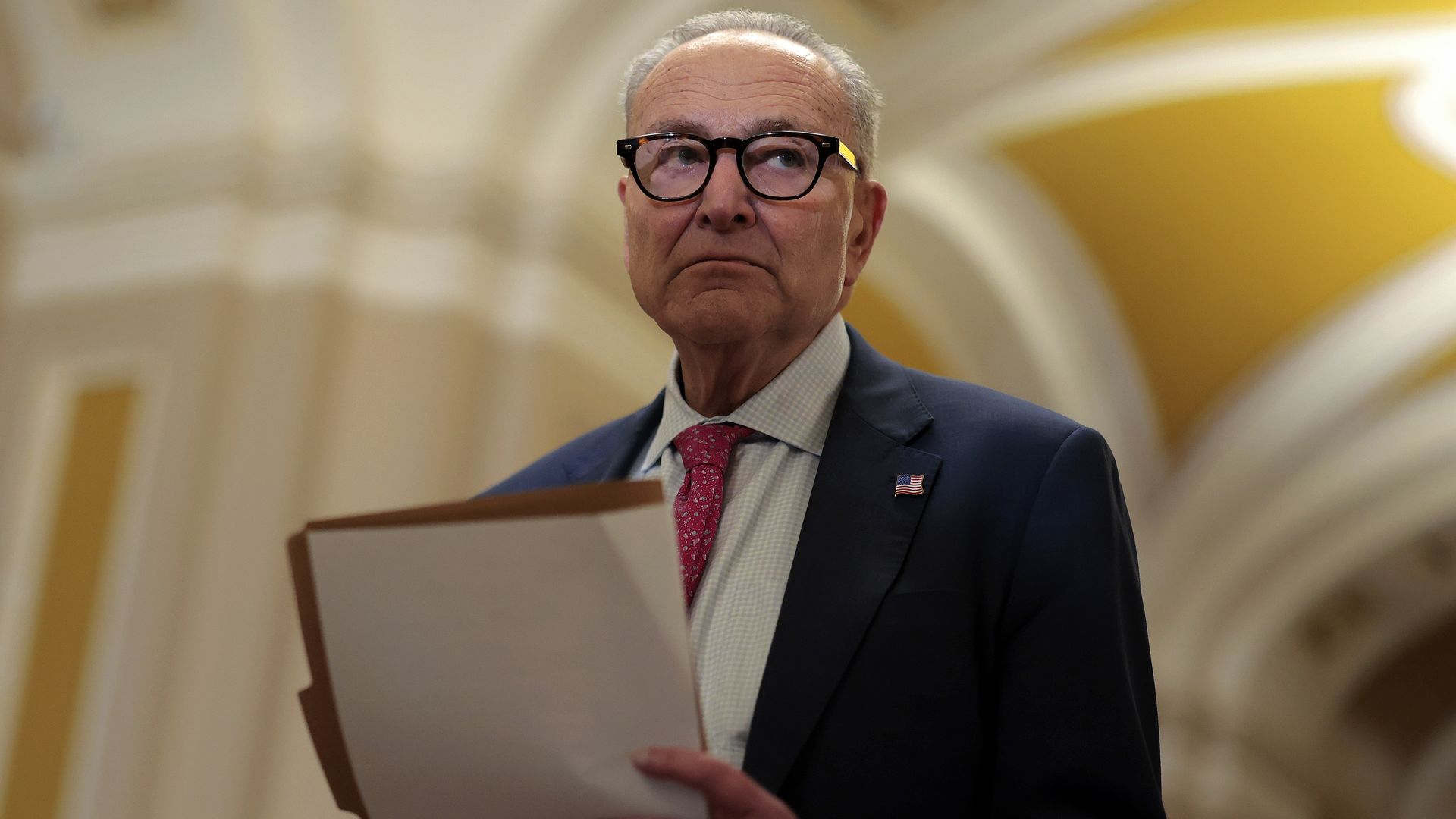 Sen. Chuck Schumer walks through the U.S. Capitol after the Senate and House passed a resolution calling for the Justice Department to release all information related to Jeffrey Epstein.