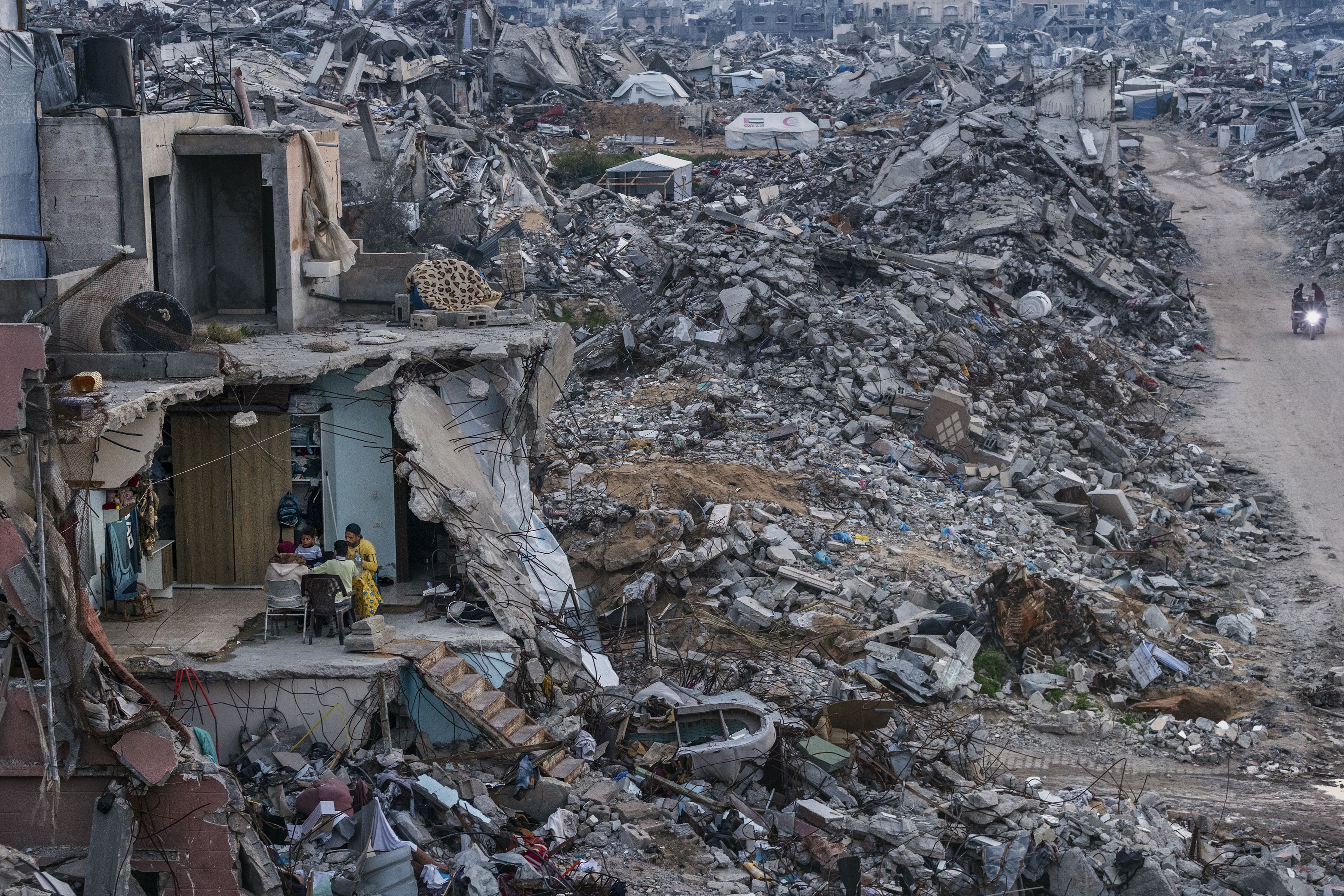 The Shafei family eats during Ramadan last year in the remains of their home in Gaza. The image was part of a portfolio that won the Pulitzer for Breaking News Photography.