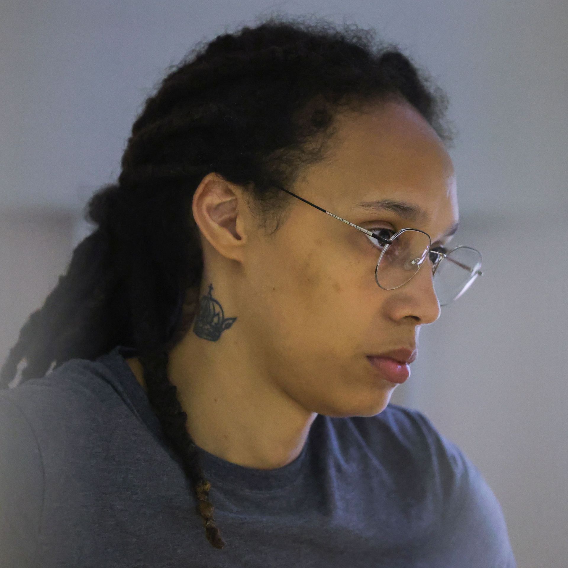 Brittney Griner inside a defendants' cage during a court hearing in Khimki, Russia, on Aug. 4.