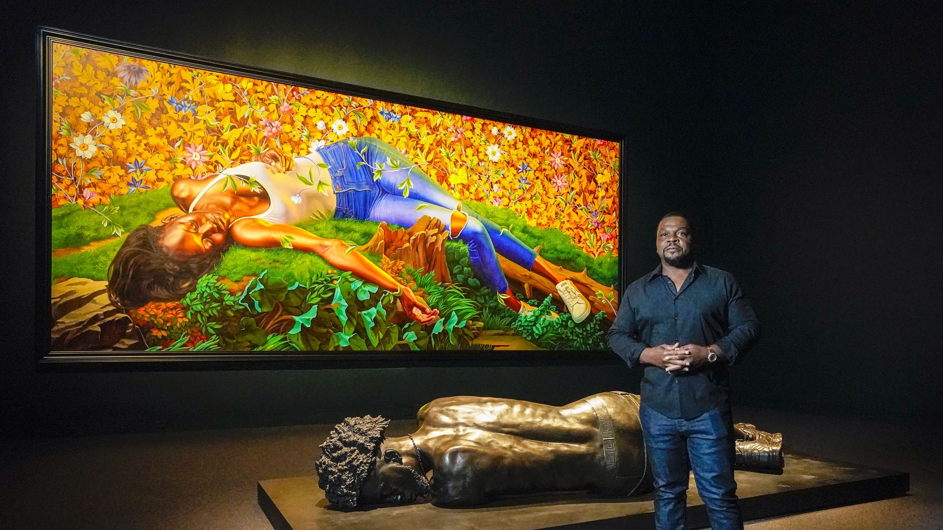 ehinde Wiley stands by Young Tarentine II (Ndeye Fatou Mbaye (oil on canvas) as well as The Birgin Martyr St. Cecilia (bronze) as he walked through his new show,
