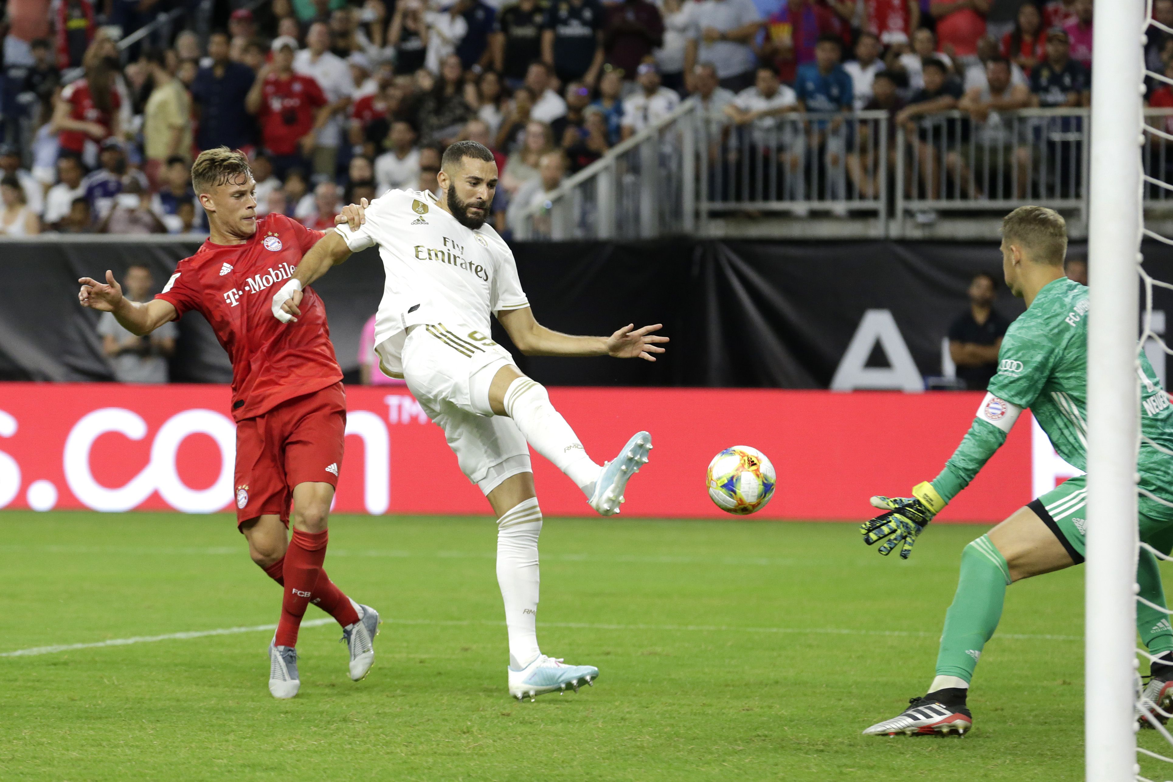 Karim Benzema #9 of Real Madrid shoots the ball against Manuel Neuer #1 of Bayern Munich during the first half in the 2019 International Champions Cup at NRG Stadium in Houston, Texas. 