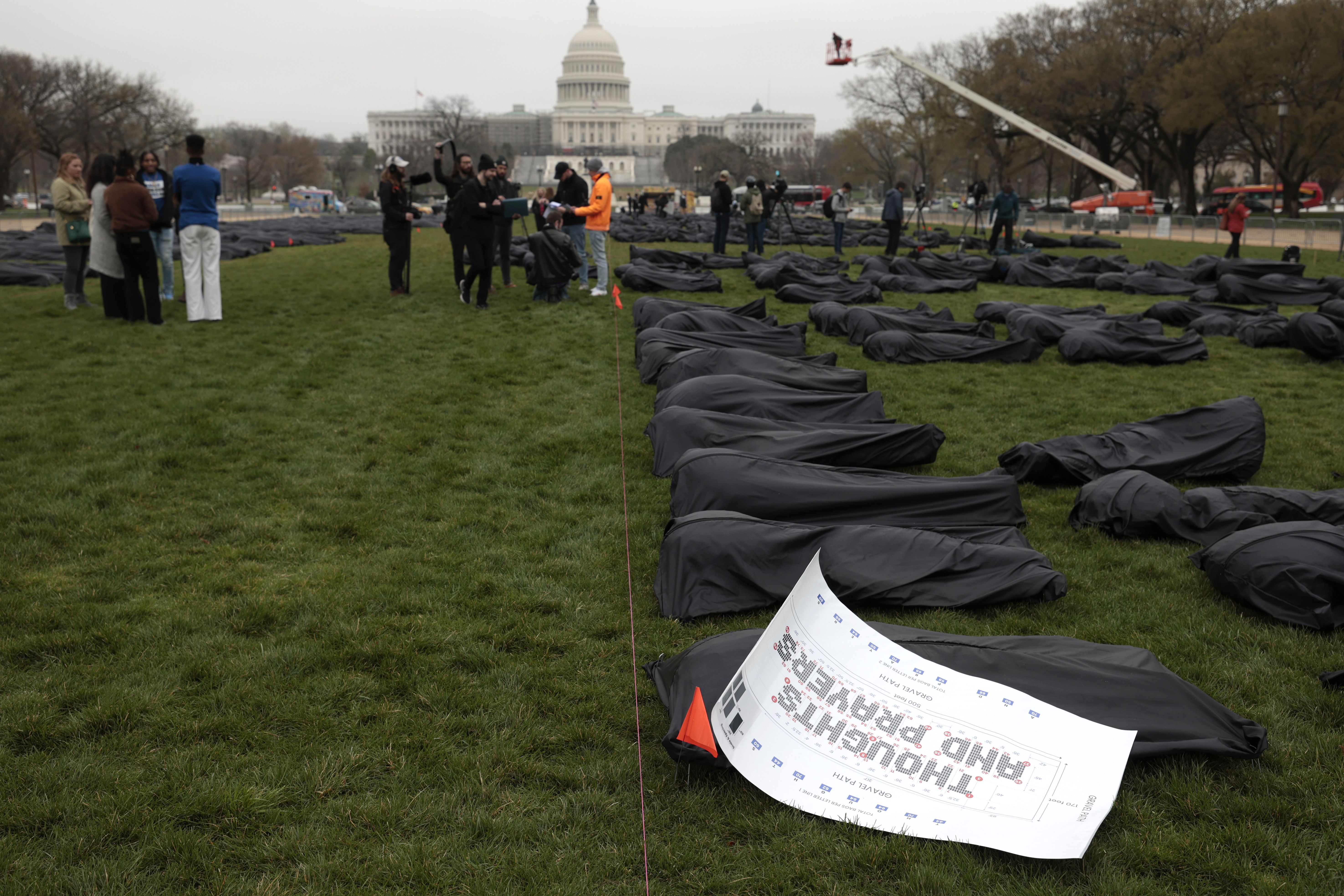 Body bags are assembled on the National Mall by gun control activist group March For Our Lives on March 24, 2022 in Washington, DC