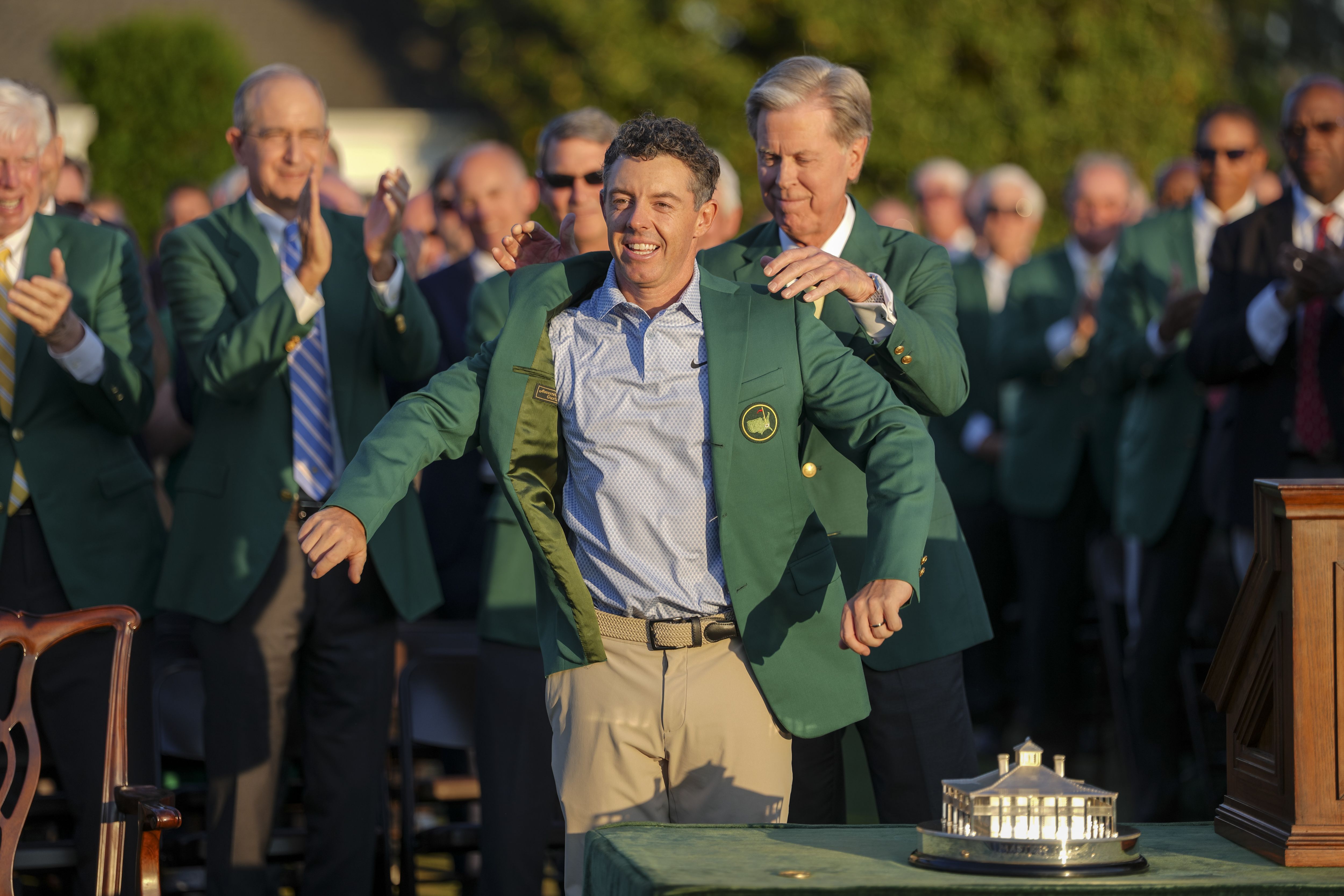 Rory McIlroy receives his second consecutive green jacket after winning the Masters yesterday.