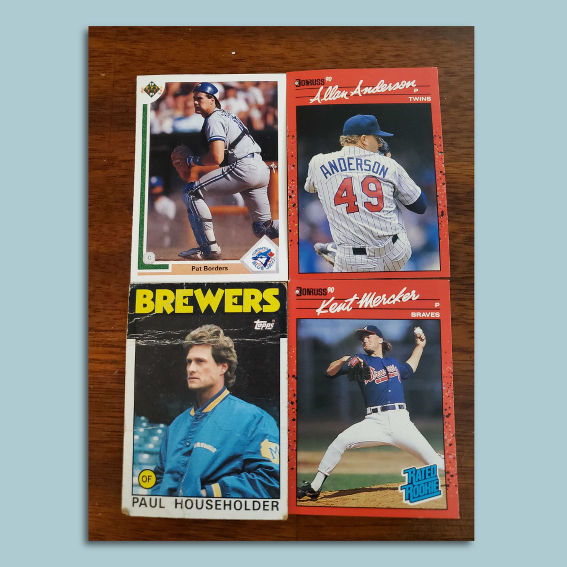 Four baseball cards in a square. 