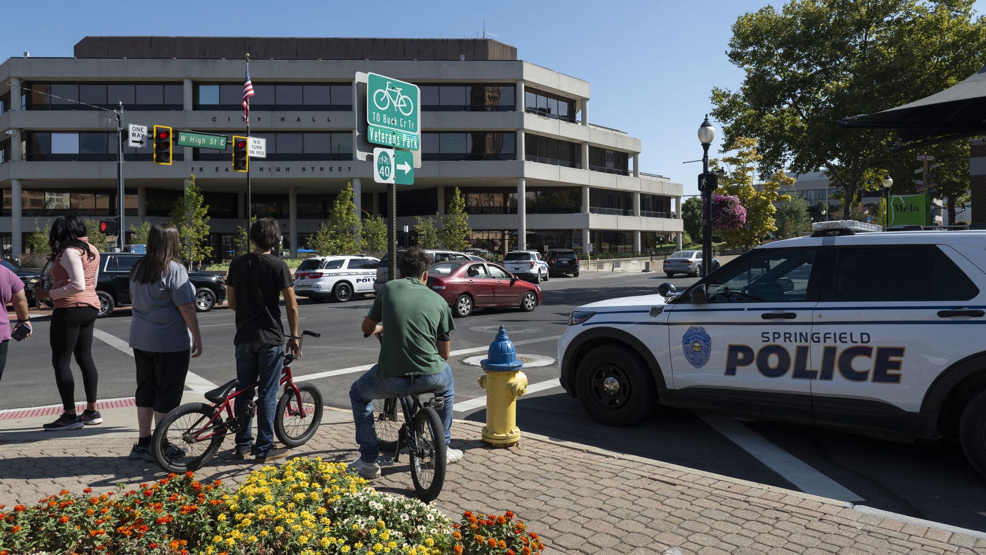 Springfield Police Department officers investigate the Springfield City Hall after bomb threats were made against buildings earlier in the day in Springfield, Ohio on September 12
