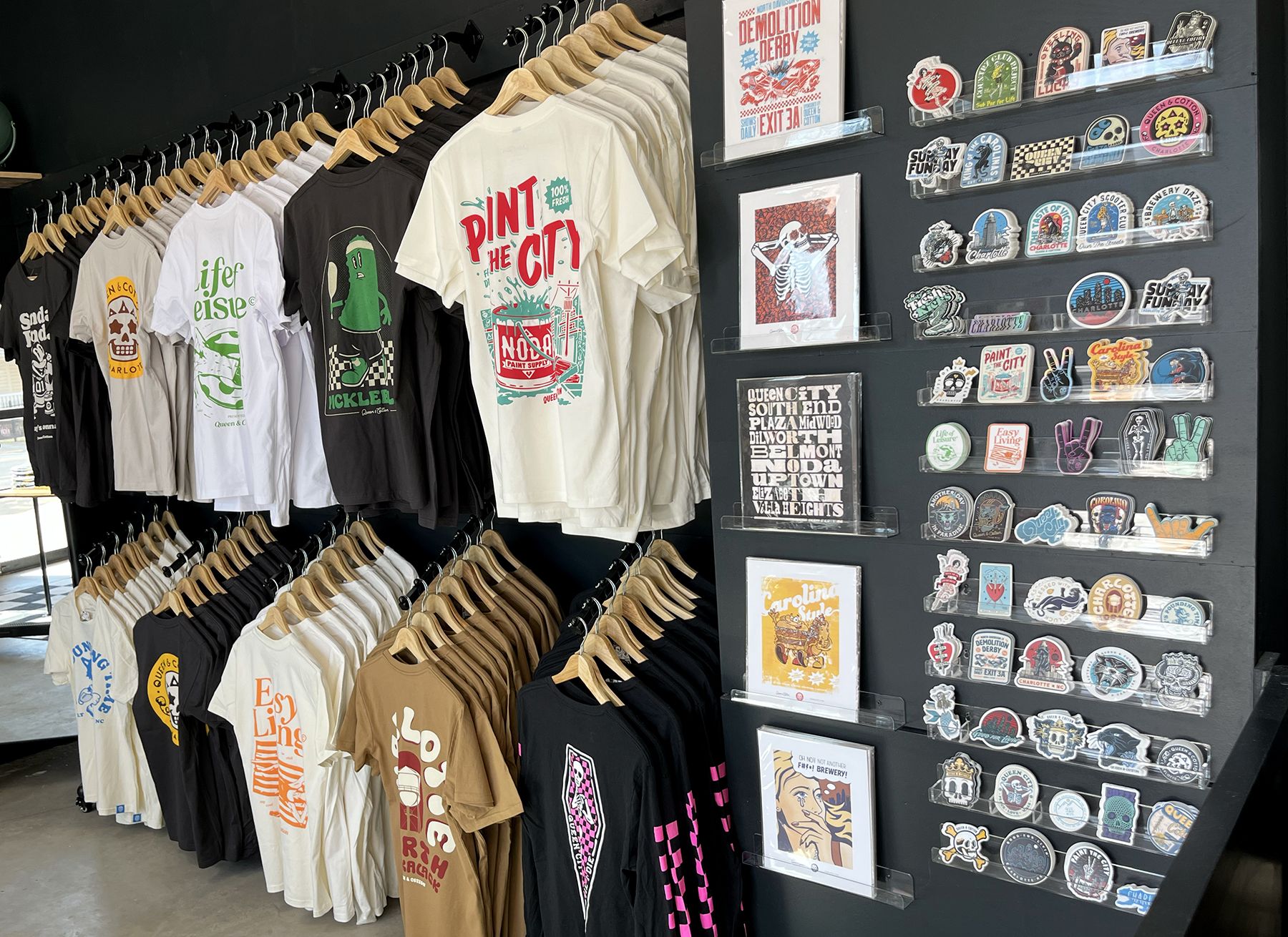 Shirts hang on a clothing shop wall