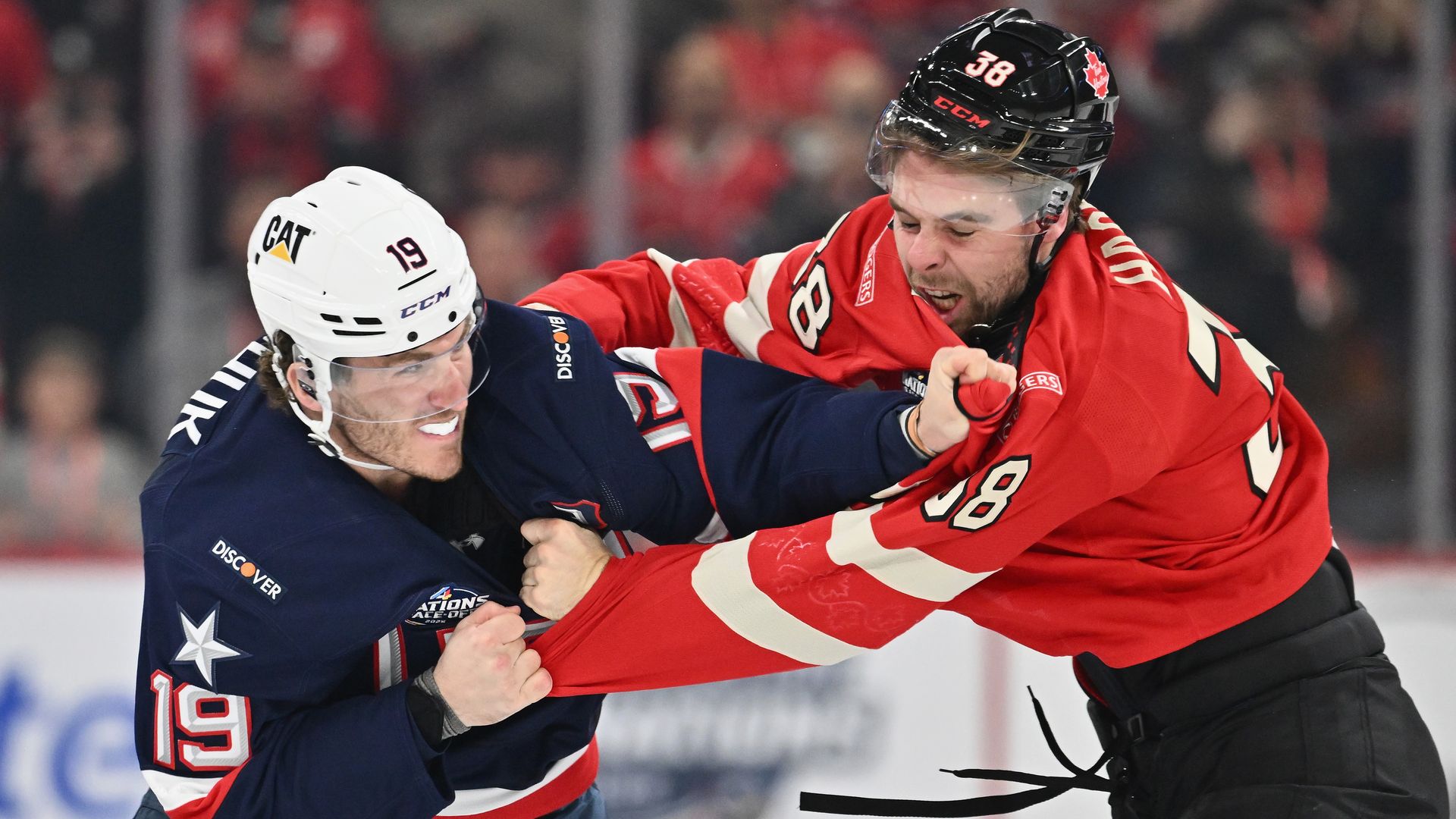 American Matthew Tkachuk and Canada's Brandon Hagel fight during the opening seconds of the NHL's 4 Nations Face-Off tournament. 