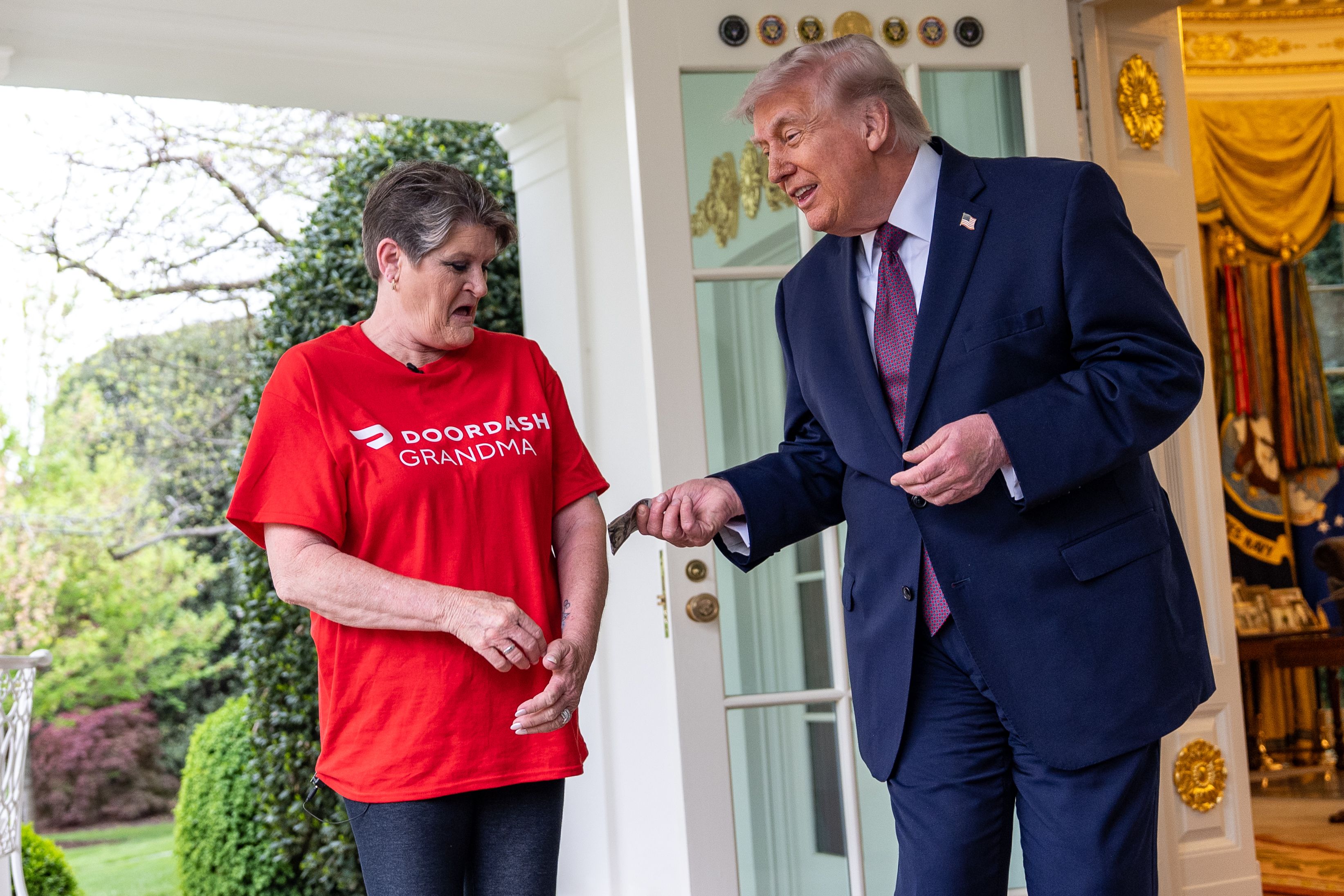 President Trump tips "DoorDash Grandma," who delivered a McDonald's order to the Oval Office yesterday to promote his "no tax on tips" policy.