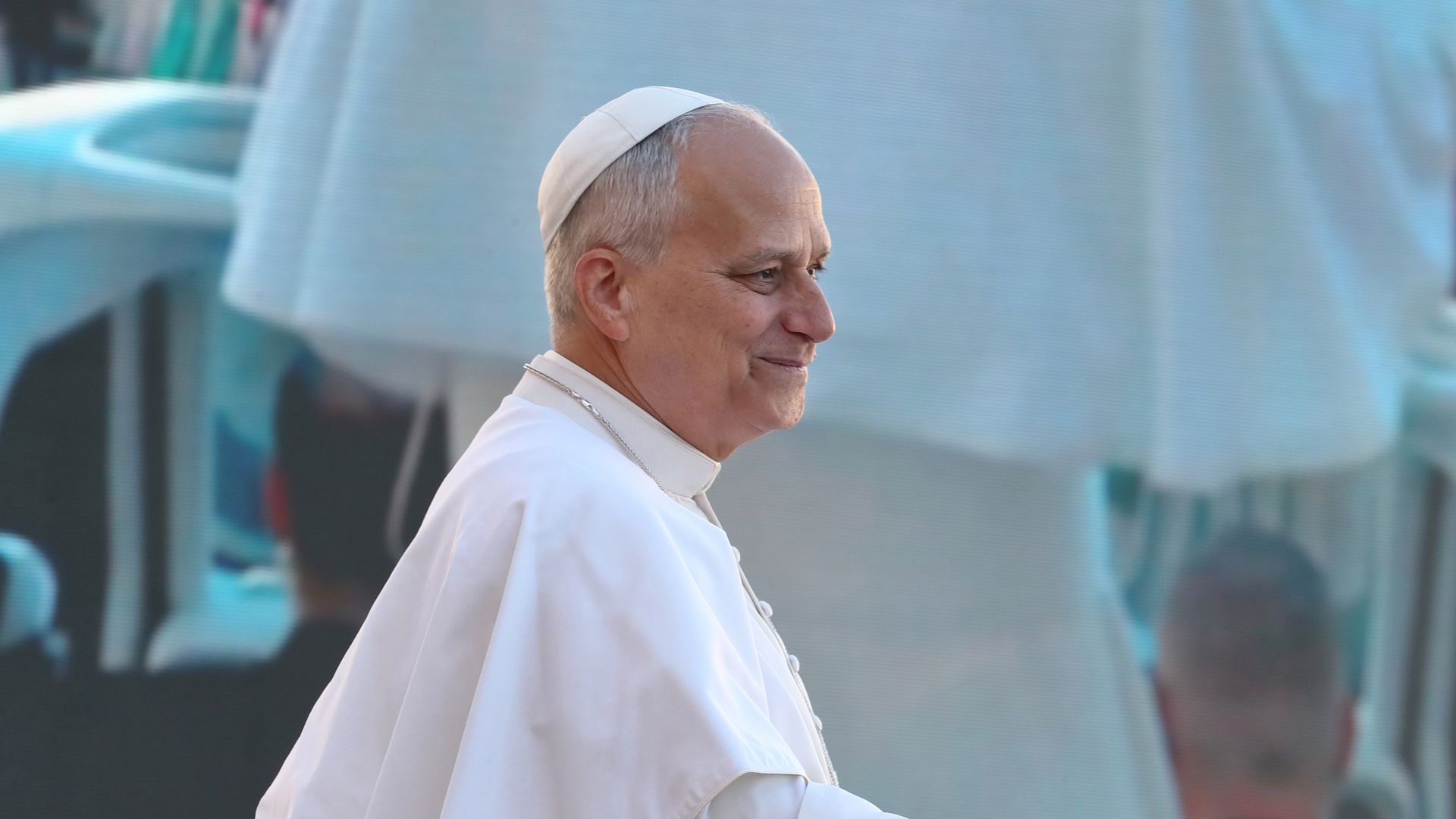 Side profile of Pope Leo XIV in white vestments.