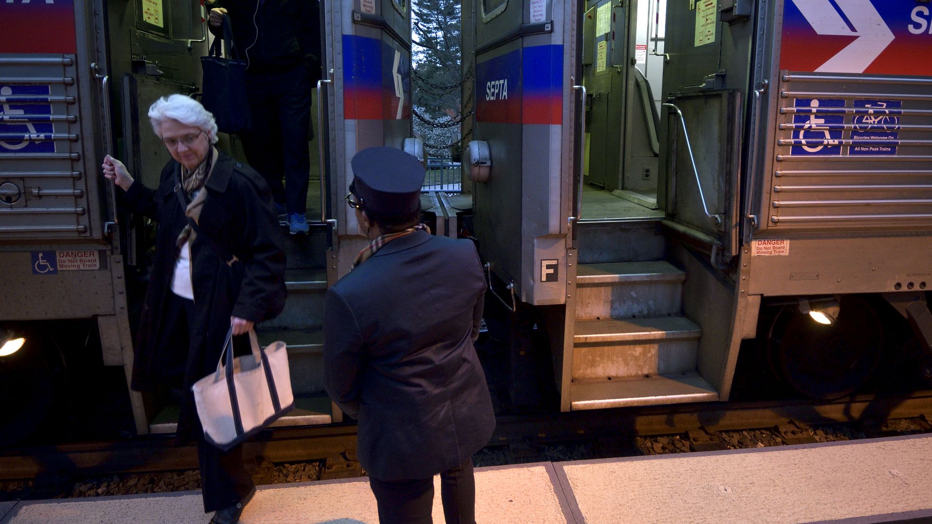 SEPTA conductor keeps a watchful eye as commuters de-board from a Silverliner IV Regional Rail train in Philadelphia, PA. Photo: Bastiaan Slabbers/Getty Images