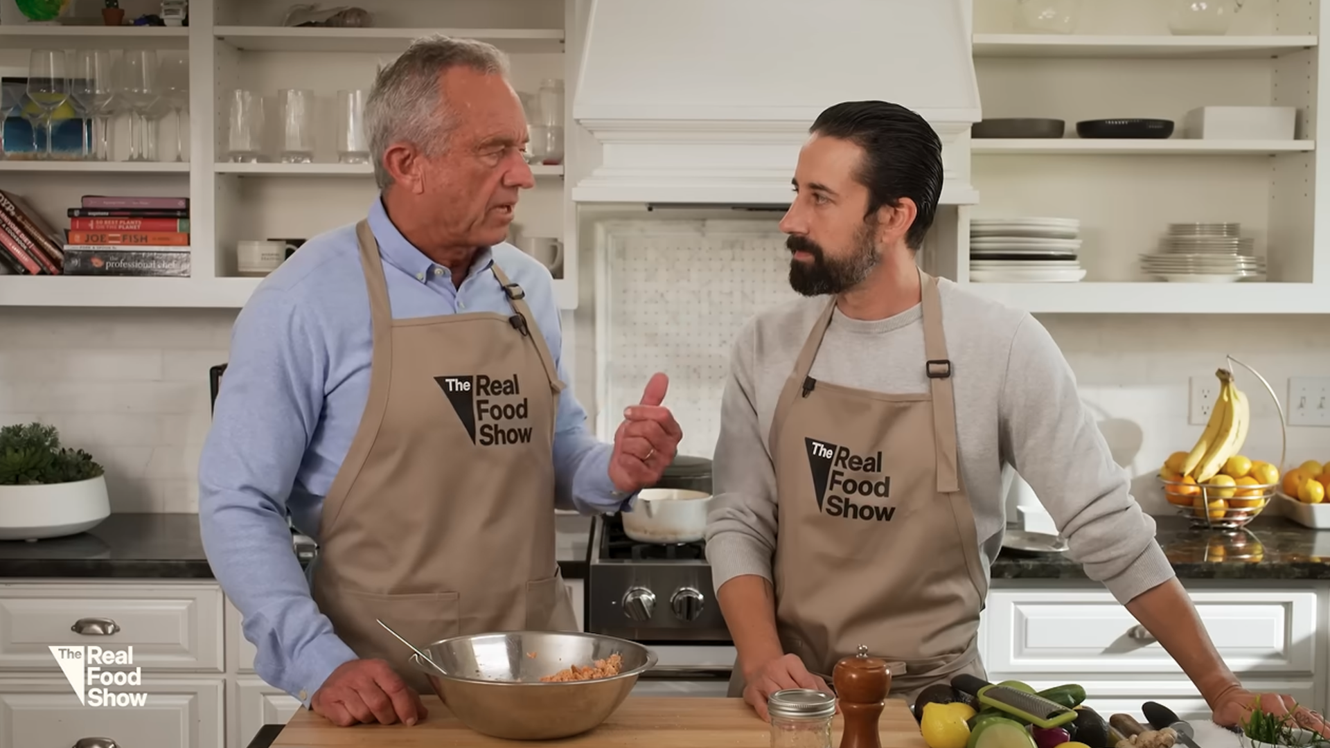 RFK Jr. hosts The Real Food Show, wearing an apron and speaking alongside chef Andrew Gruel