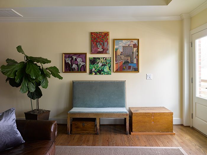Bruce-Moffett-Home-Tour-living-room-bench-family-art