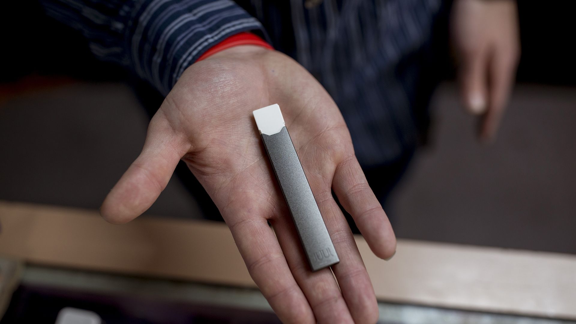 E-cigarette that is black and small.