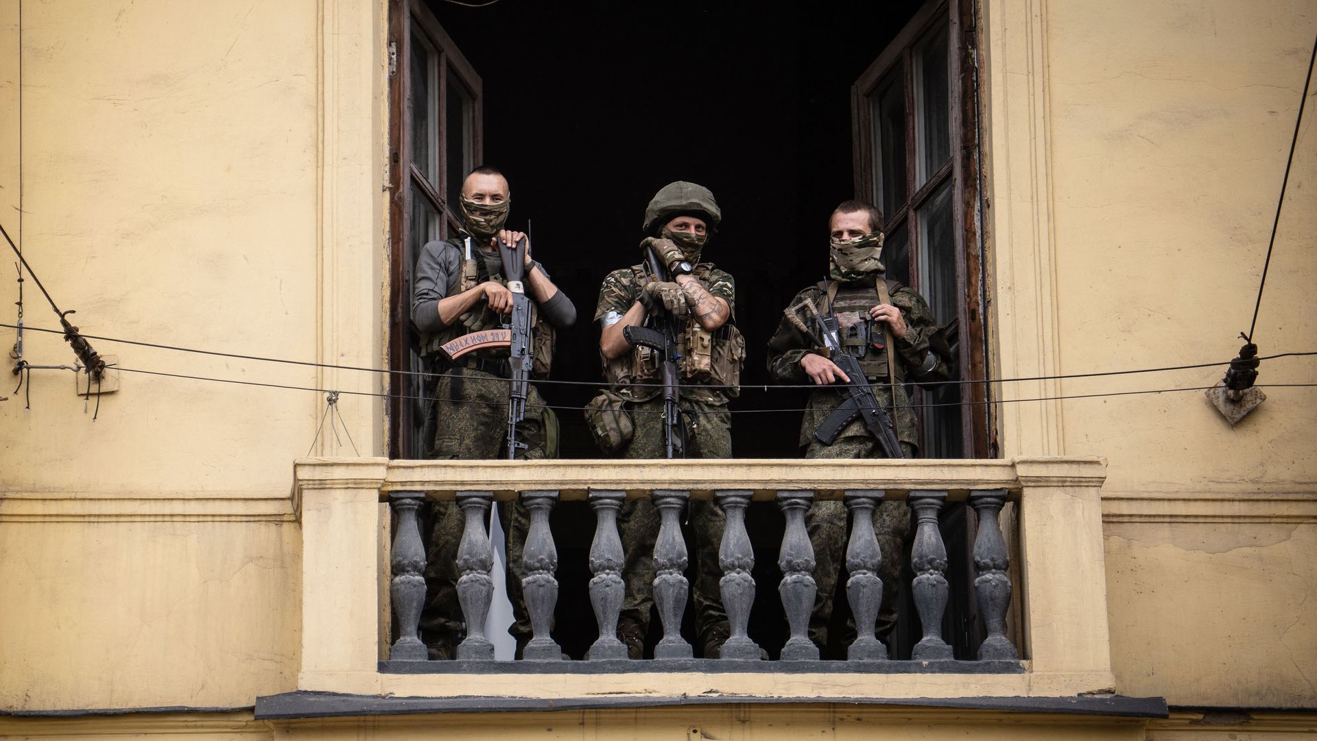 Members of Wagner group stand on the balcony of a building in the city of Rostov-on-Don June 24. Photo: Roman Romokhov/AFP via Getty Images