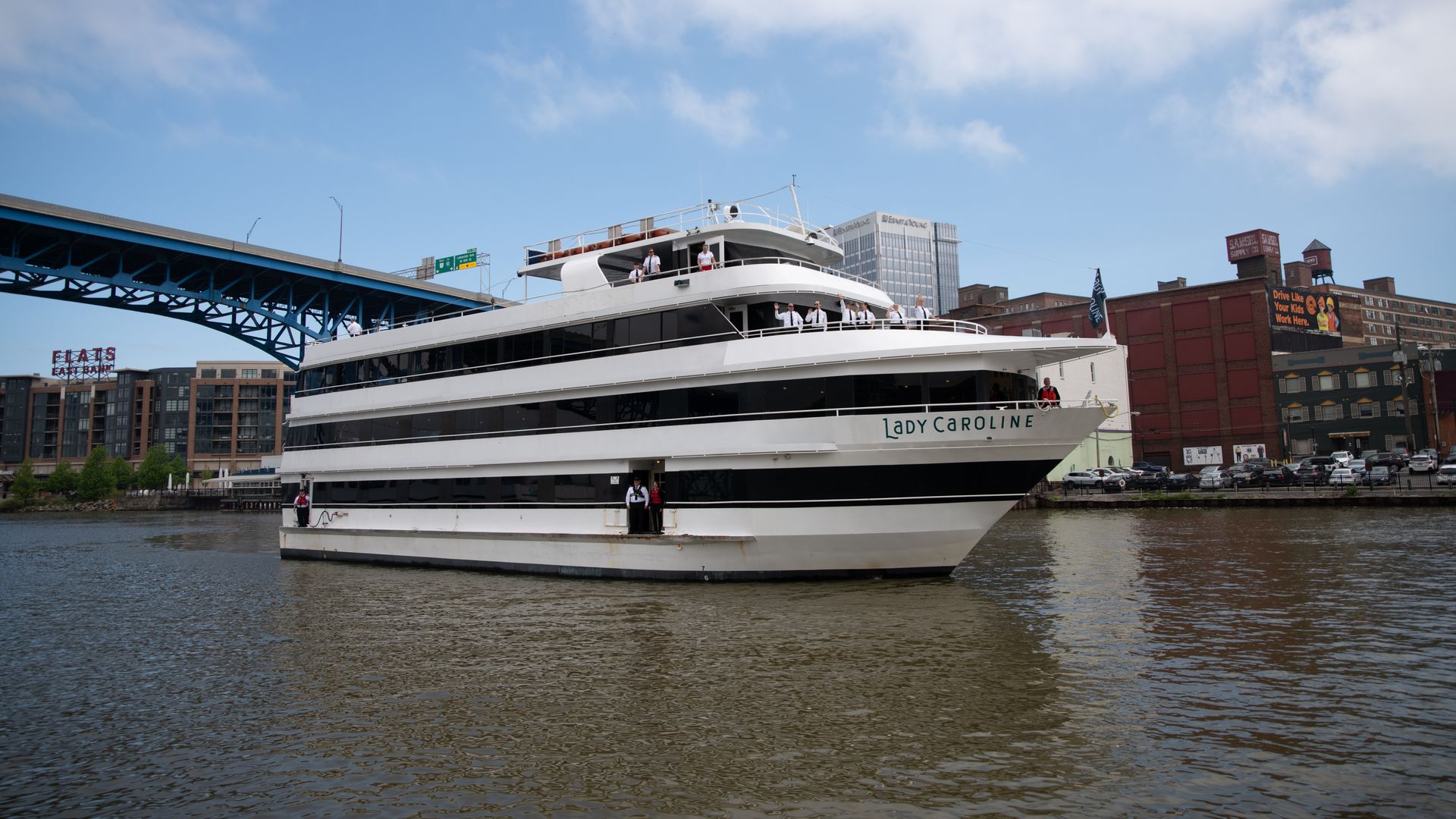 A boat travels on a river in Cleveland. 