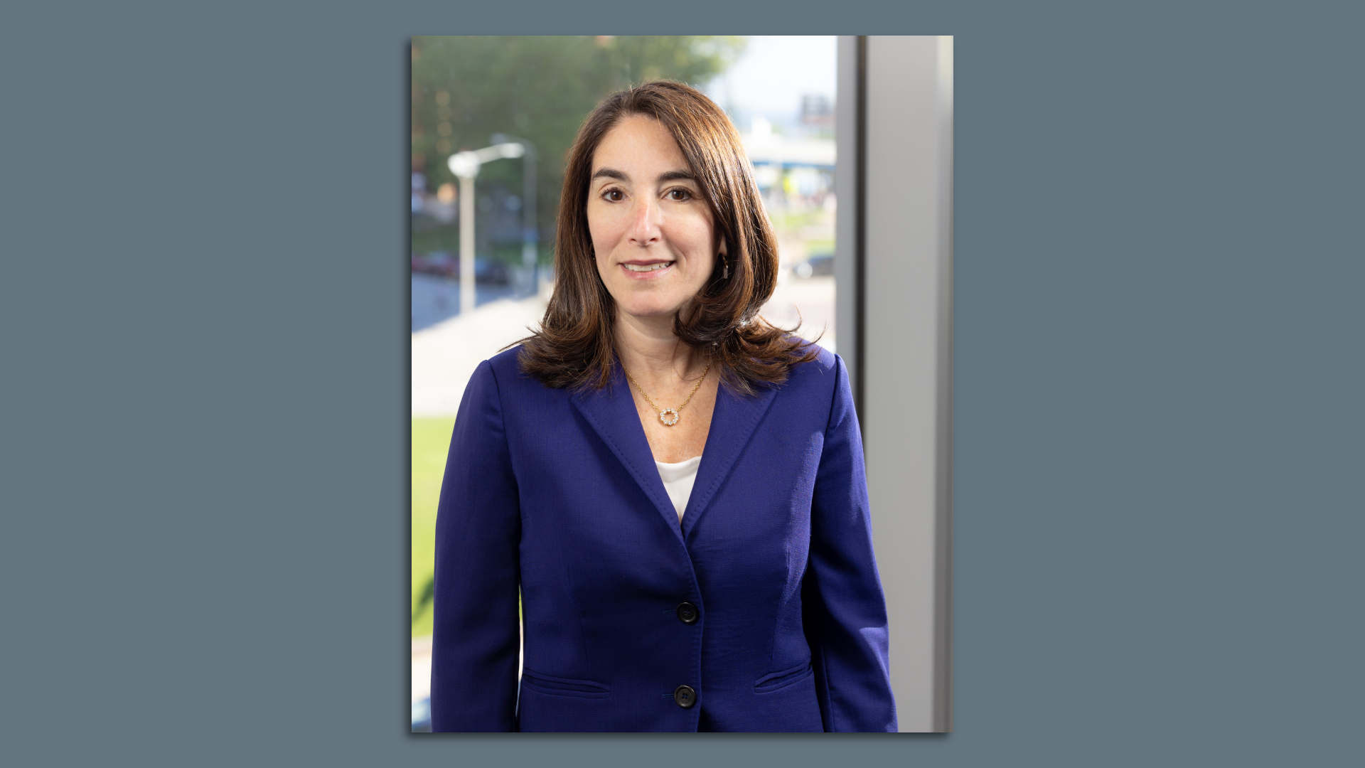 Headshot of woman in blue suit 