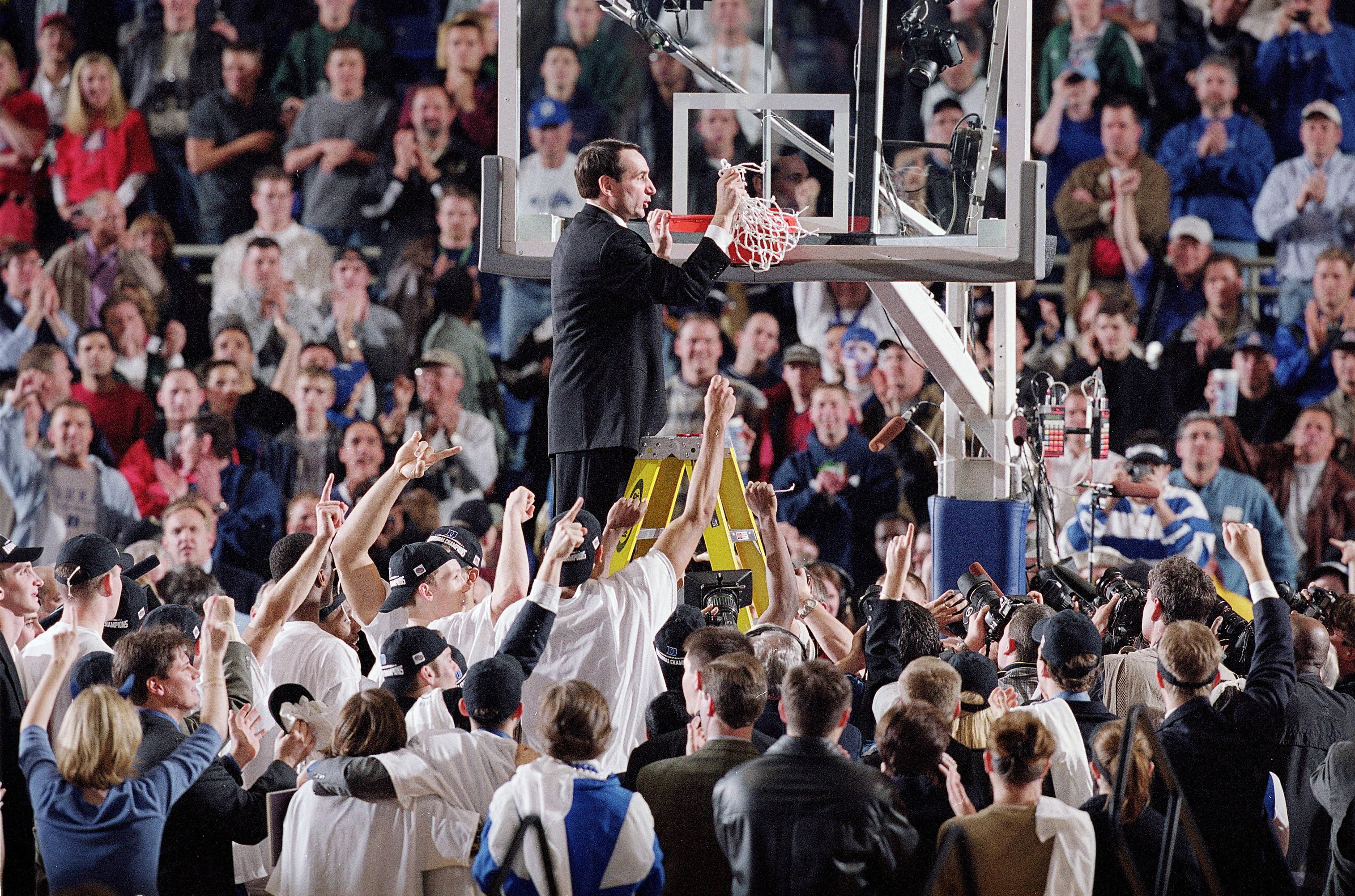 College Basketball: NCAA Final Four: Duke head coach Mike Krzyzewski victorious, cutting down net during celebration after winning National Championship game vs Arizona at H.H. Humphrey Metrodome. Minneapolis, MN 4/2/2001 CREDIT: John W. McDonough (Photo by John W. McDonough /Sports Illustrated via Getty Images) (Set Number: X62848 TK2 R20 F30 )