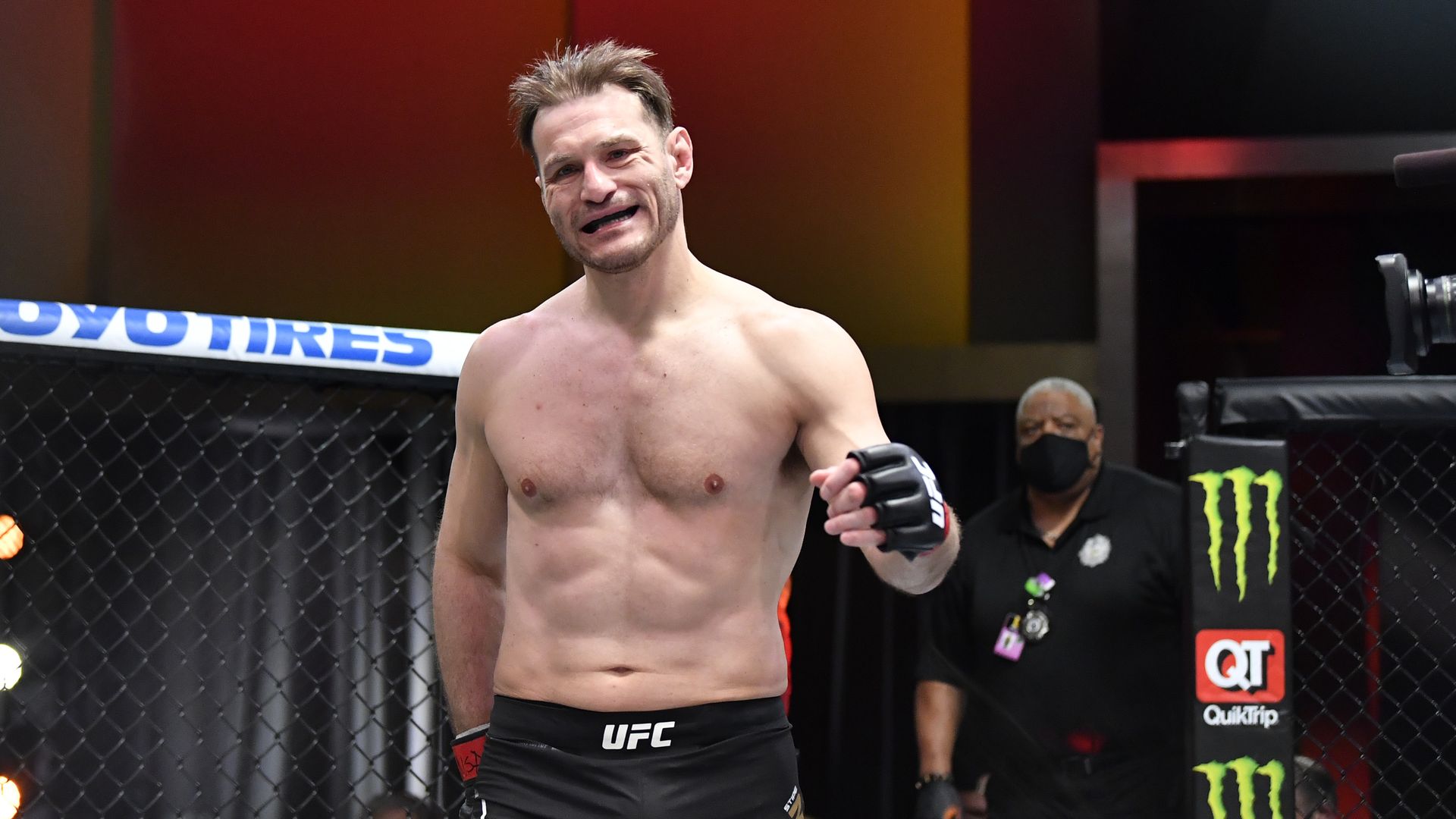 UFC fighter Stipe Miocic walks into the Octagon. 
