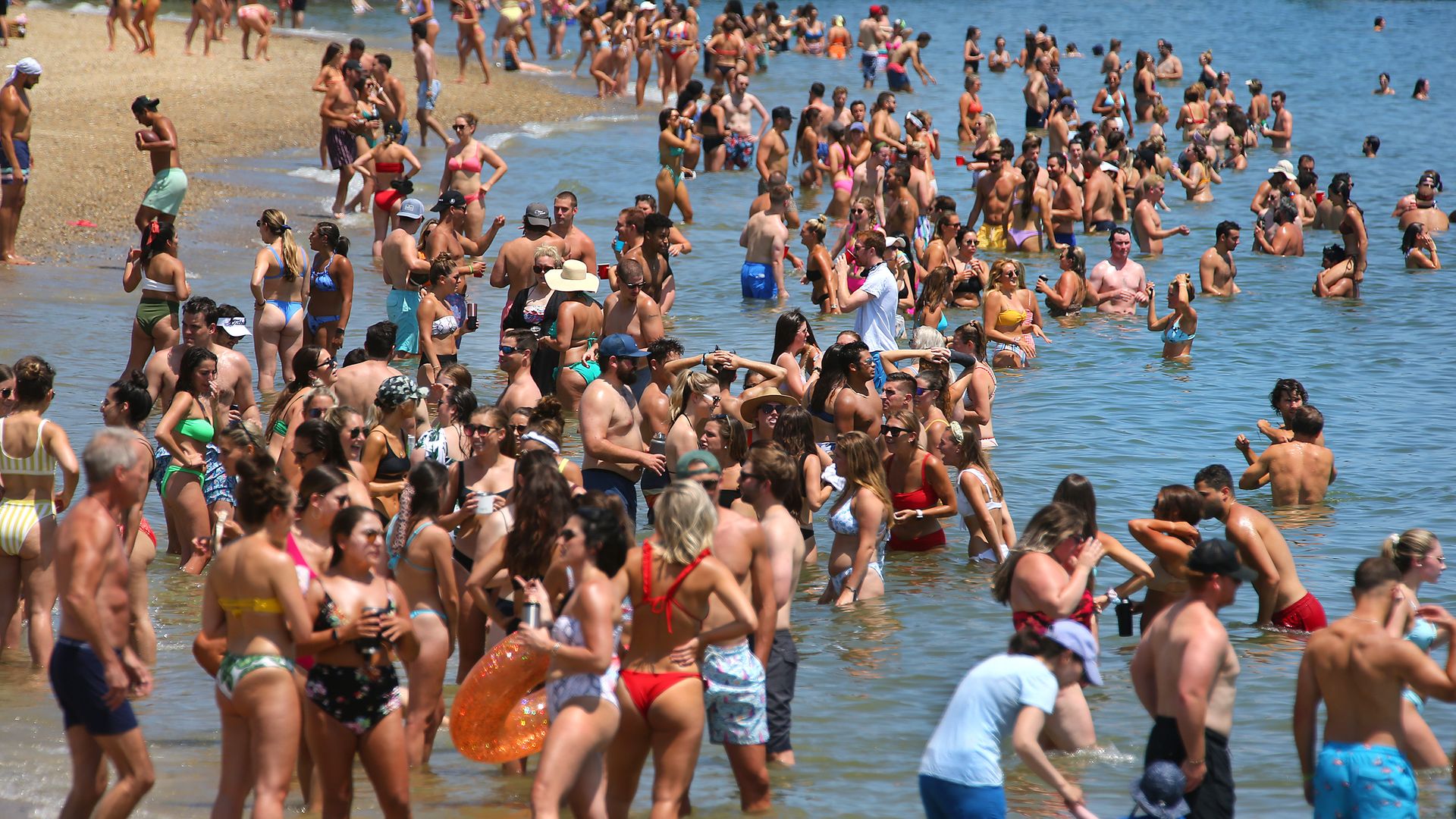Hundreds of beachgoers pack in without social distancing