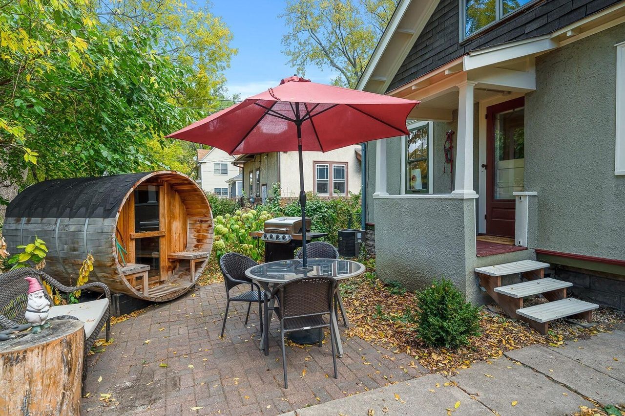 backyard with dry sauna and sitting area on patio