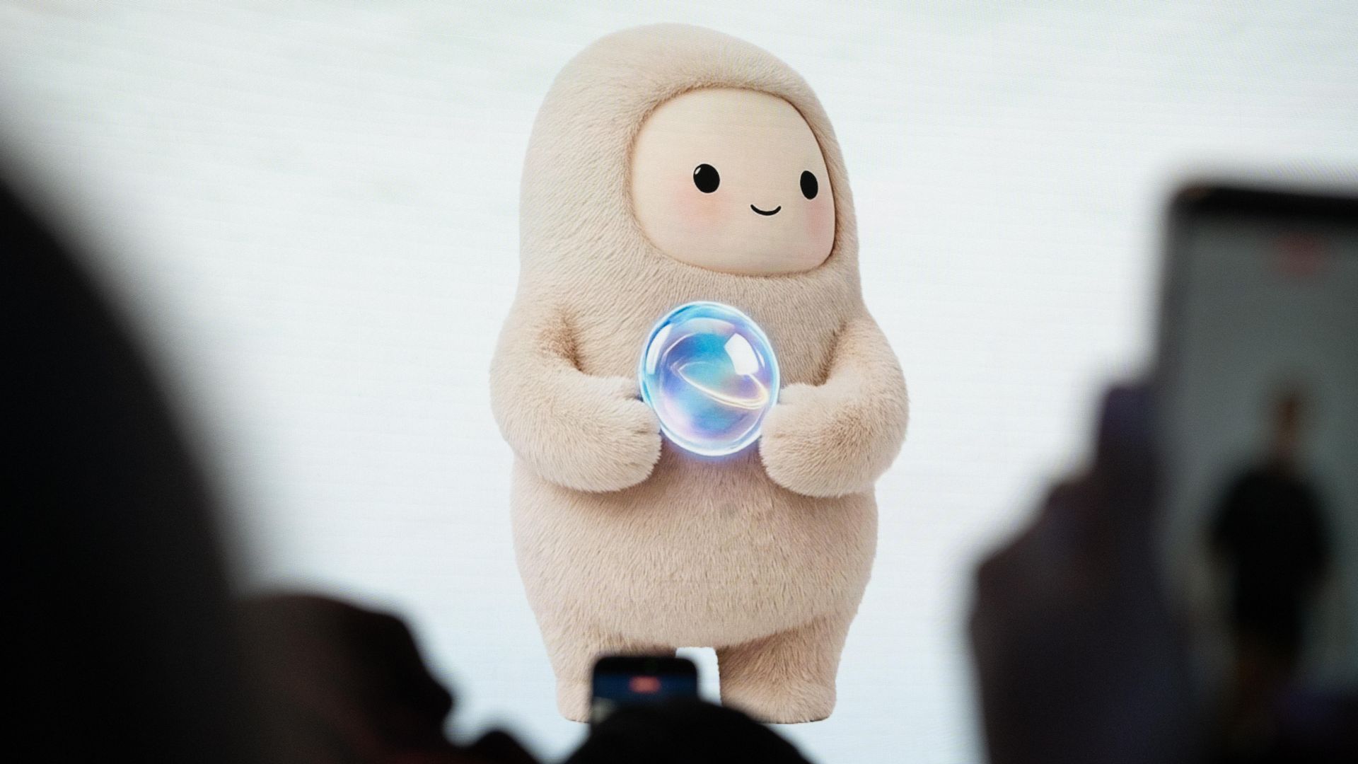 An smiling, plush avatar for Muse, Meta's AI Agent, shown on a screen during the Meta Connect event.