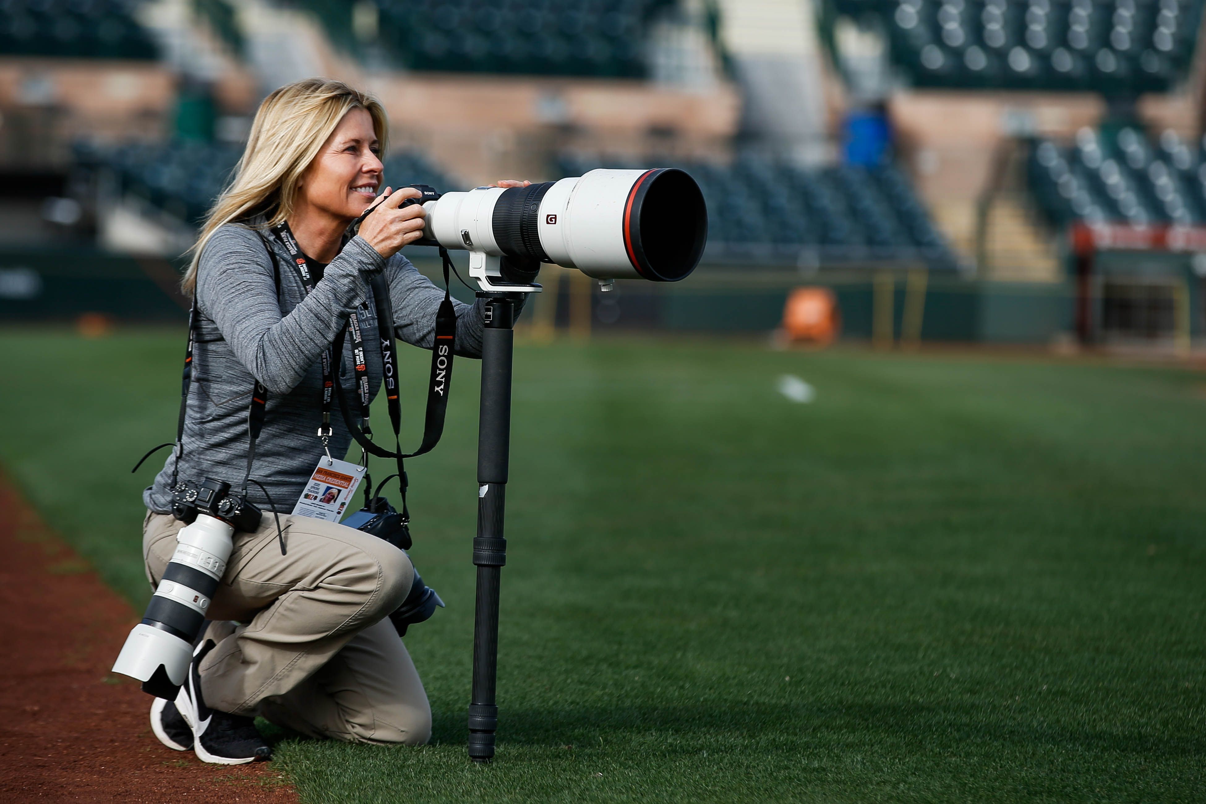 Baseball photographer Jean Fruth in action.\