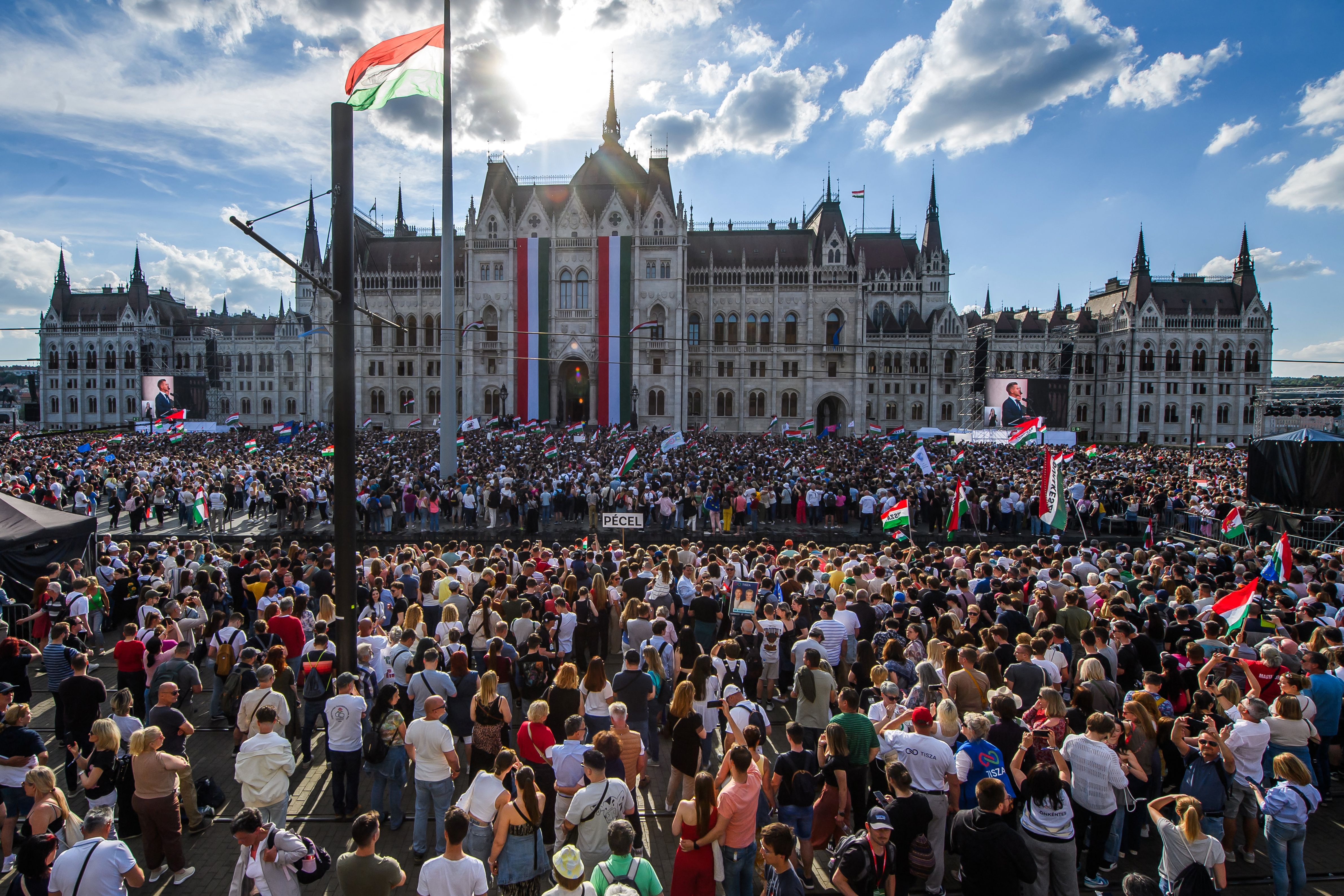A huge, jubilant crowd watches the swearing-in of Peter Magyar, Hungary's new prime minister, on a screen outside the Hungarian Parliament building in Budapest yesterday. Photo: Ferenc Isza/AFP via Getty Images