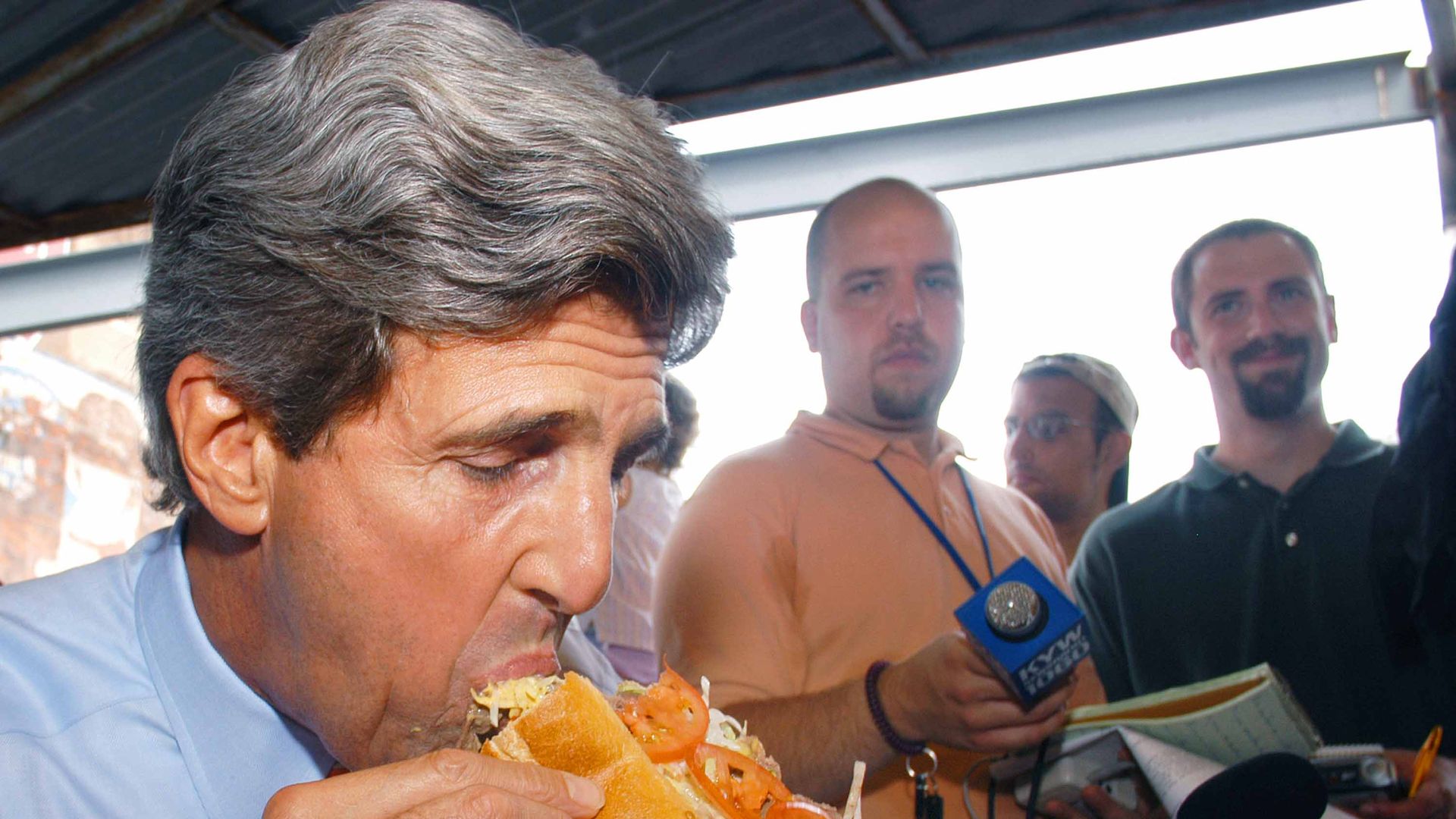 Former presidential candidate John Kerry eats a Philly cheesesteak during a 2003 campaign stop at Pat's King of Steaks.