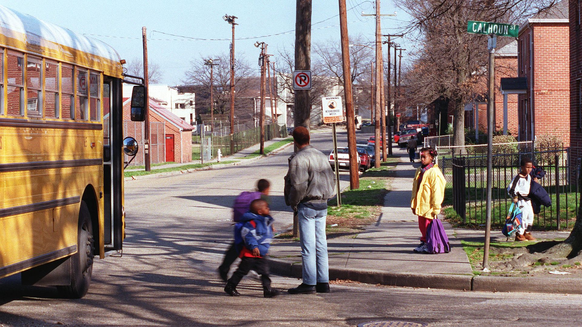 kids getting off a school bus on calhoun street