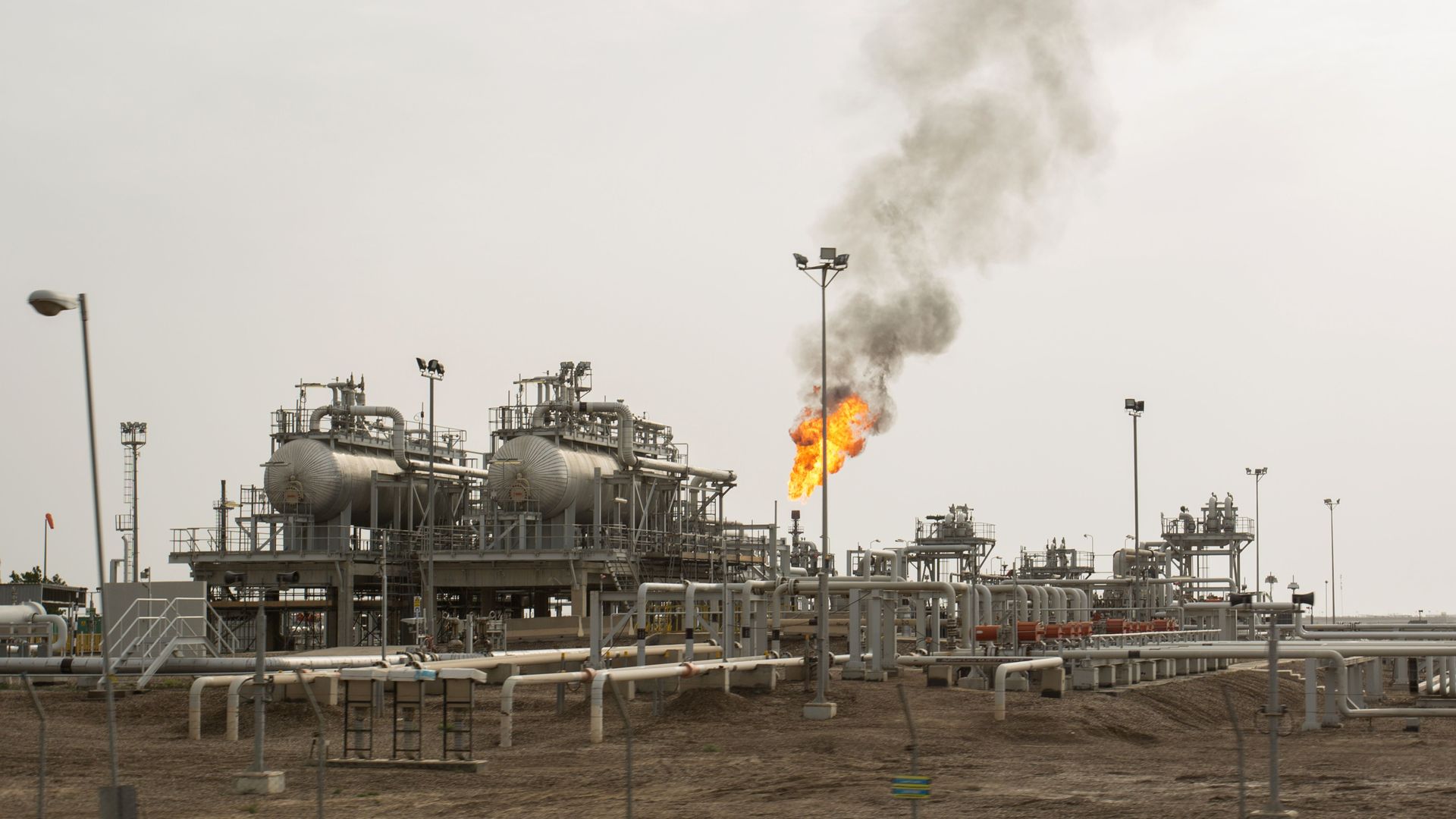 This is an image of machinery in an oil installation in a dirt field in Iraq.