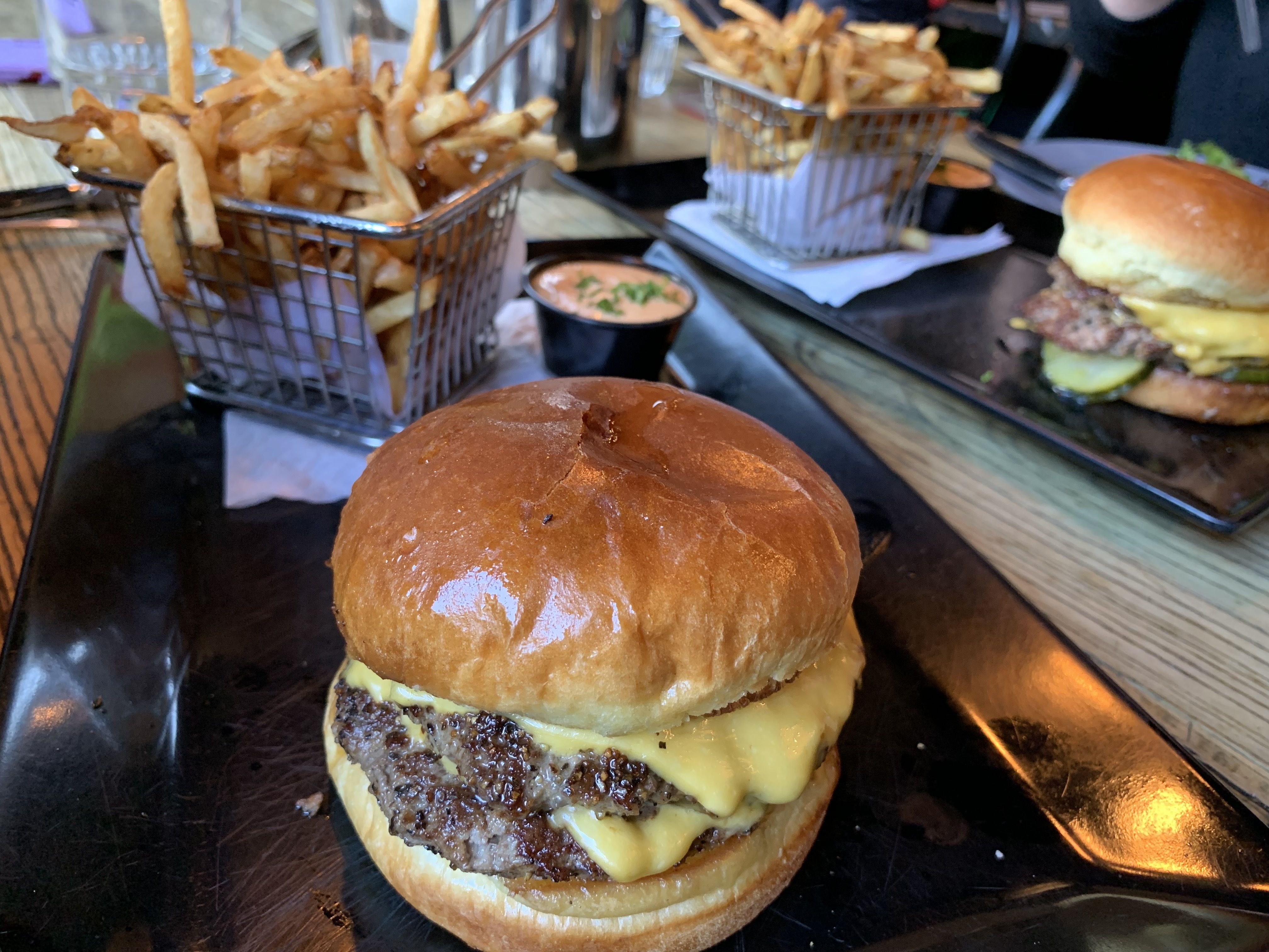 Photo of a cheeseburger on a plate. 