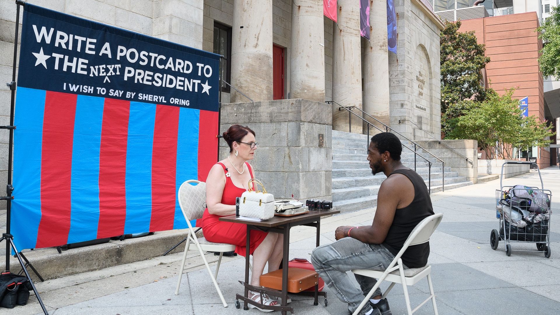 Artist Sheryl Oring dictates a message from Zakiah Miles during her Aug. 15 stop in Philly.