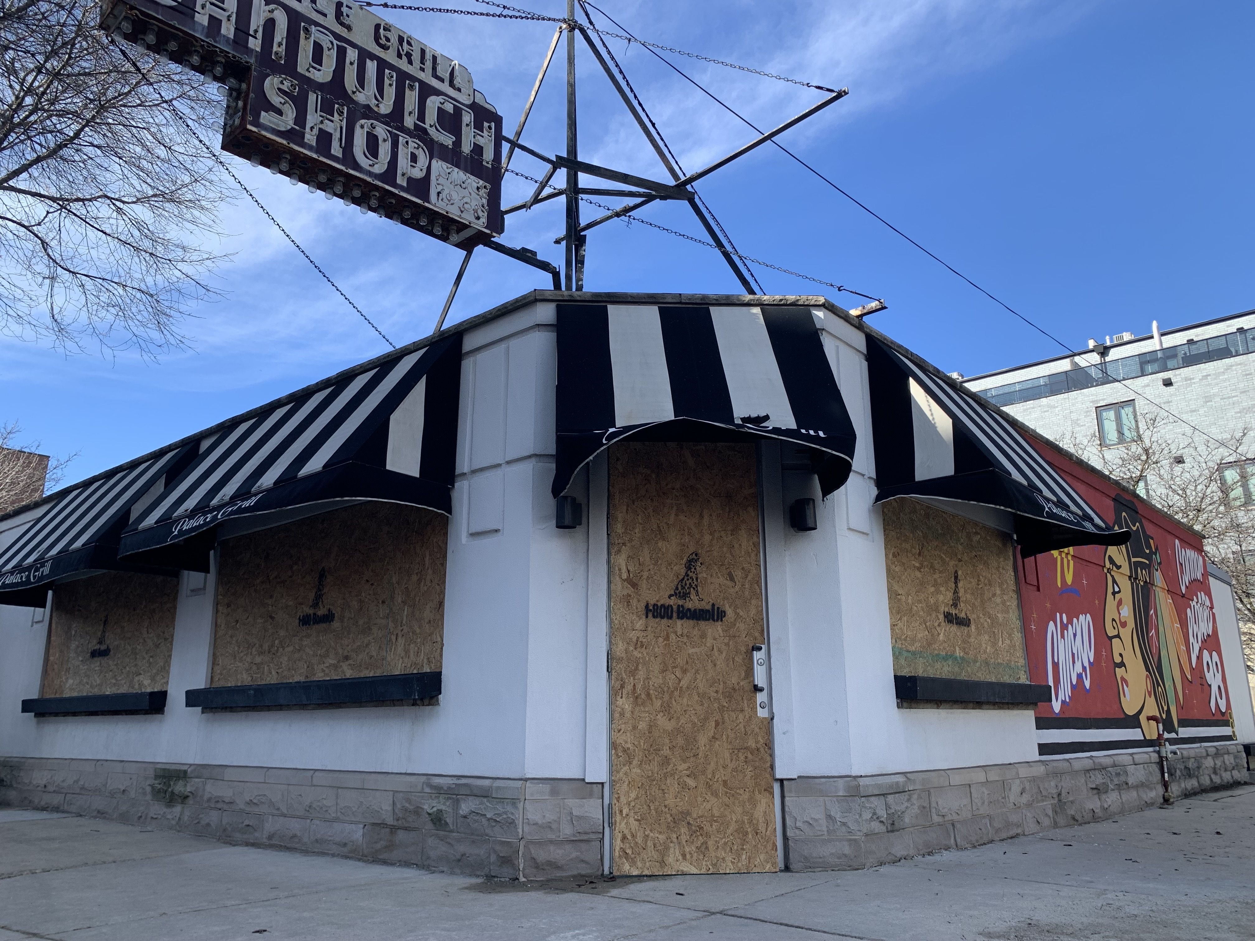 Photo of a boarded up diner 