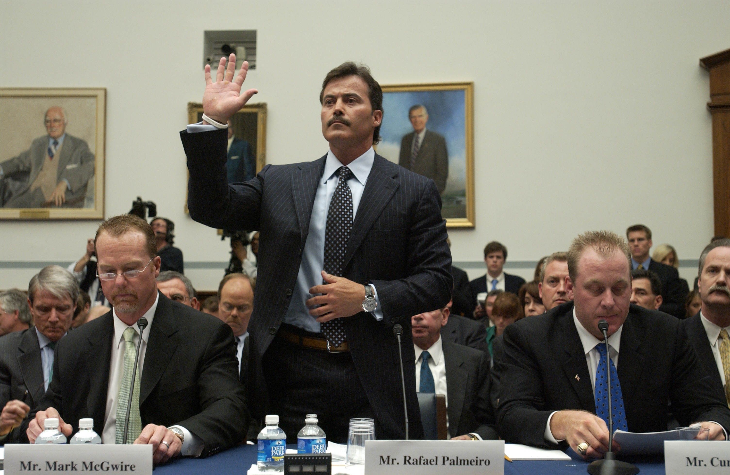 Rafael Palmeiro standing before Congress